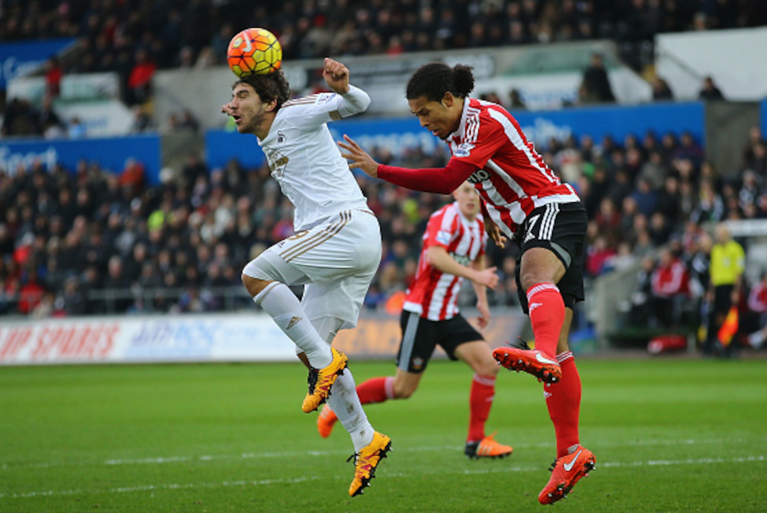 SWANSEA, WALES - FEBRUARY 13: Alberto Paloschi of Swansea City and Virgil van Dijk of Southampton compete for the ball during the Barclays Premier League match between Swansea City and Southampton at Liberty Stadium on February 13, 2016 in Swansea, Wales. SWANSEA, WALES - FEBRUARY 13: Alberto Paloschi of Swansea City and Virgil van Dijk of Southampton compete for the ball during the Barclays Premier League match between Swansea City and Southampton at Liberty Stadium on February 13, 2016 in Swansea, Wales.