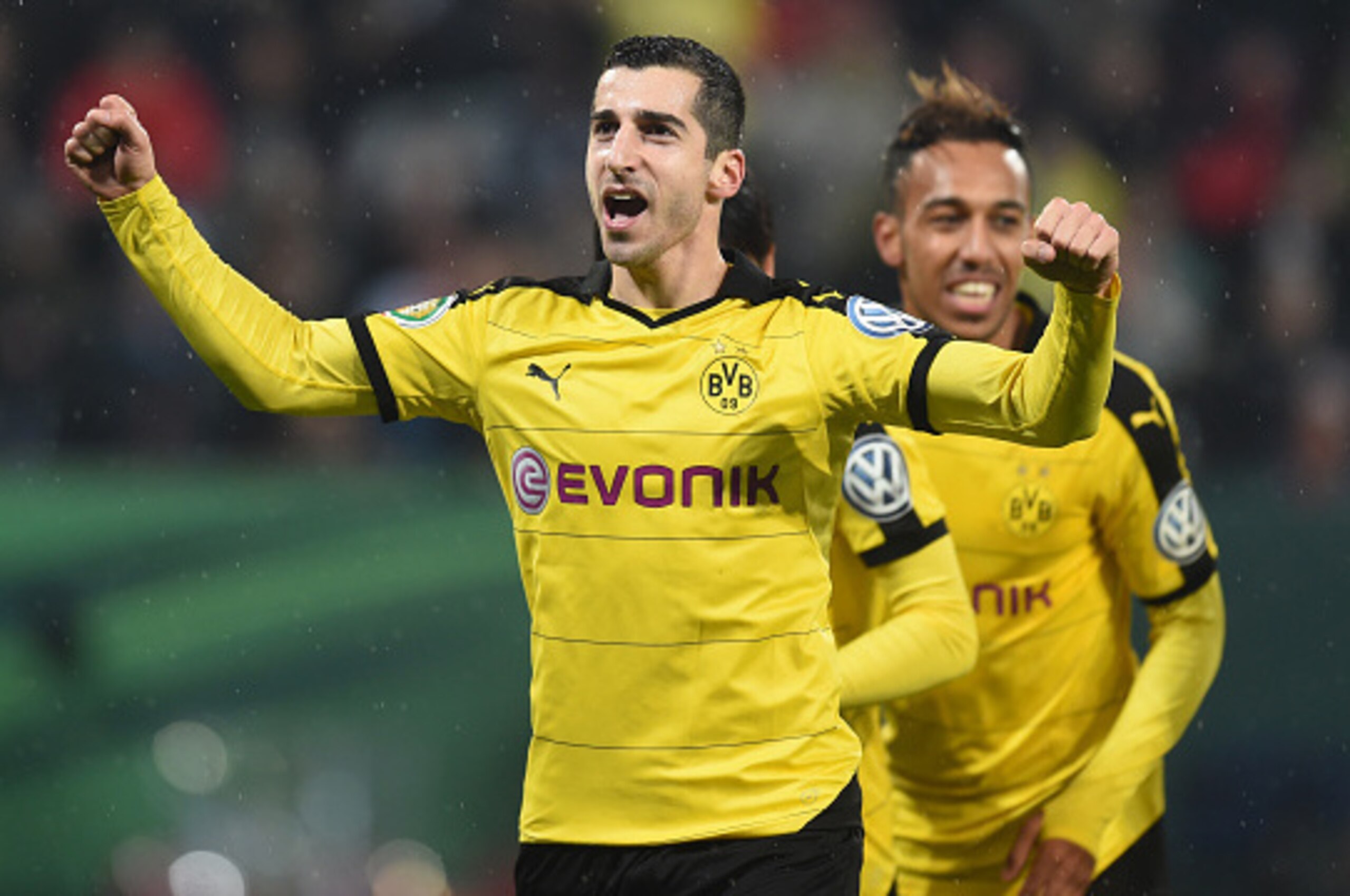 (L-R) Dortmund's Armenian midfielder Henrikh Mkhitaryan, Dortmund's Gabonese striker Pierre-Emerick Aubameyang celebrate after the second goal during the German Cup DFB Pokal third round match between Borussia Dortmund and FC Augsburg in Augsburg on Decem