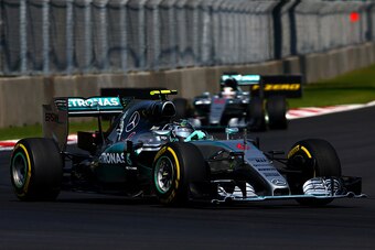 MEXICO CITY, MEXICO - NOVEMBER 01:  Nico Rosberg of Germany and Mercedes GP drives ahead of Lewis Hamilton of Great Britain and Mercedes GP during the Formula One Grand Prix of Mexico at Autodromo Hermanos Rodriguez  on November 1, 2015 in Mexico City, Me
