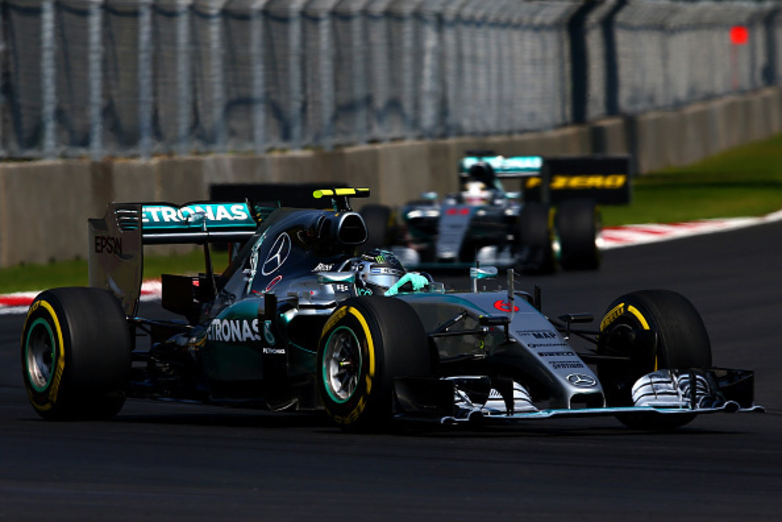 MEXICO CITY, MEXICO - NOVEMBER 01:  Nico Rosberg of Germany and Mercedes GP drives ahead of Lewis Hamilton of Great Britain and Mercedes GP during the Formula One Grand Prix of Mexico at Autodromo Hermanos Rodriguez  on November 1, 2015 in Mexico City, Me