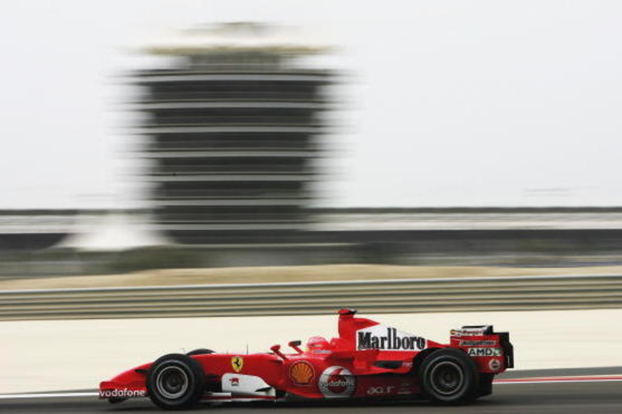 AL MANAMHA, BAHRAIN - MARCH 11:  Michael Schumacher of Germany and Ferrari in action during qualifying for the Bahrain Formula One Grand Prix at the Bahrain International Circuit on March 11, 2006 in Sakhir, Bahrain.  (Photo by Clive Mason/Getty Images)