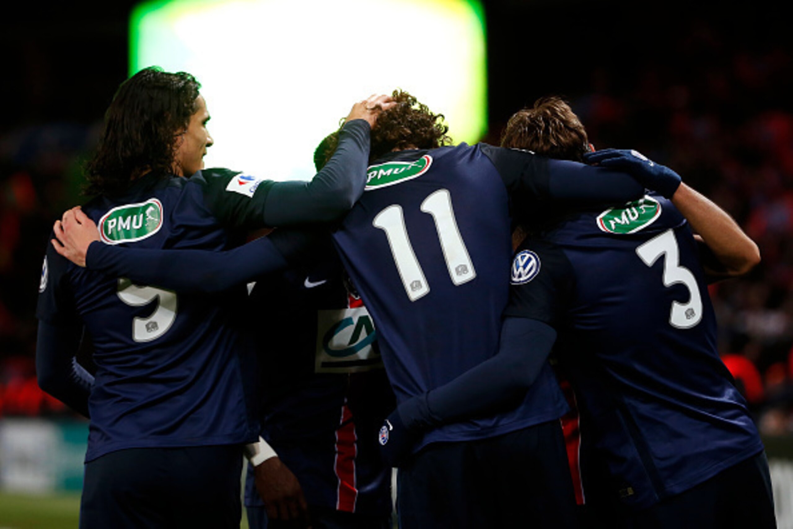 Paris Saint-Germain's French midfielder Adrien Rabiot (C) is congratulated by his teammates after scoring a goal during the French Cup round of sixteen football match between Paris Saint-Germain (PSG) and Lyon (OL) on February 10, 2016, at the Parc des Pr
