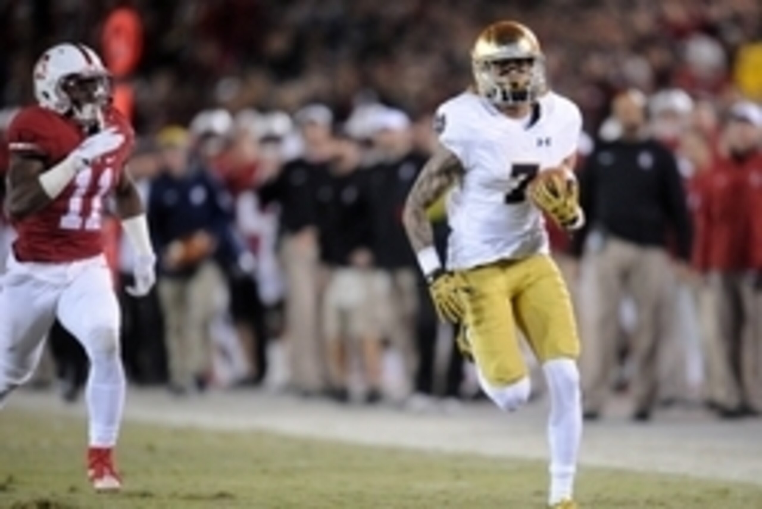 November 28, 2015; Stanford, CA, USA; Notre Dame Fighting Irish wide receiver Will Fuller catches a pass and runs for a touchdown ahead of Stanford Cardinal cornerback Terrence Alexander (11) during the first half at Stanford Stadium. Mandatory Credit: Ga