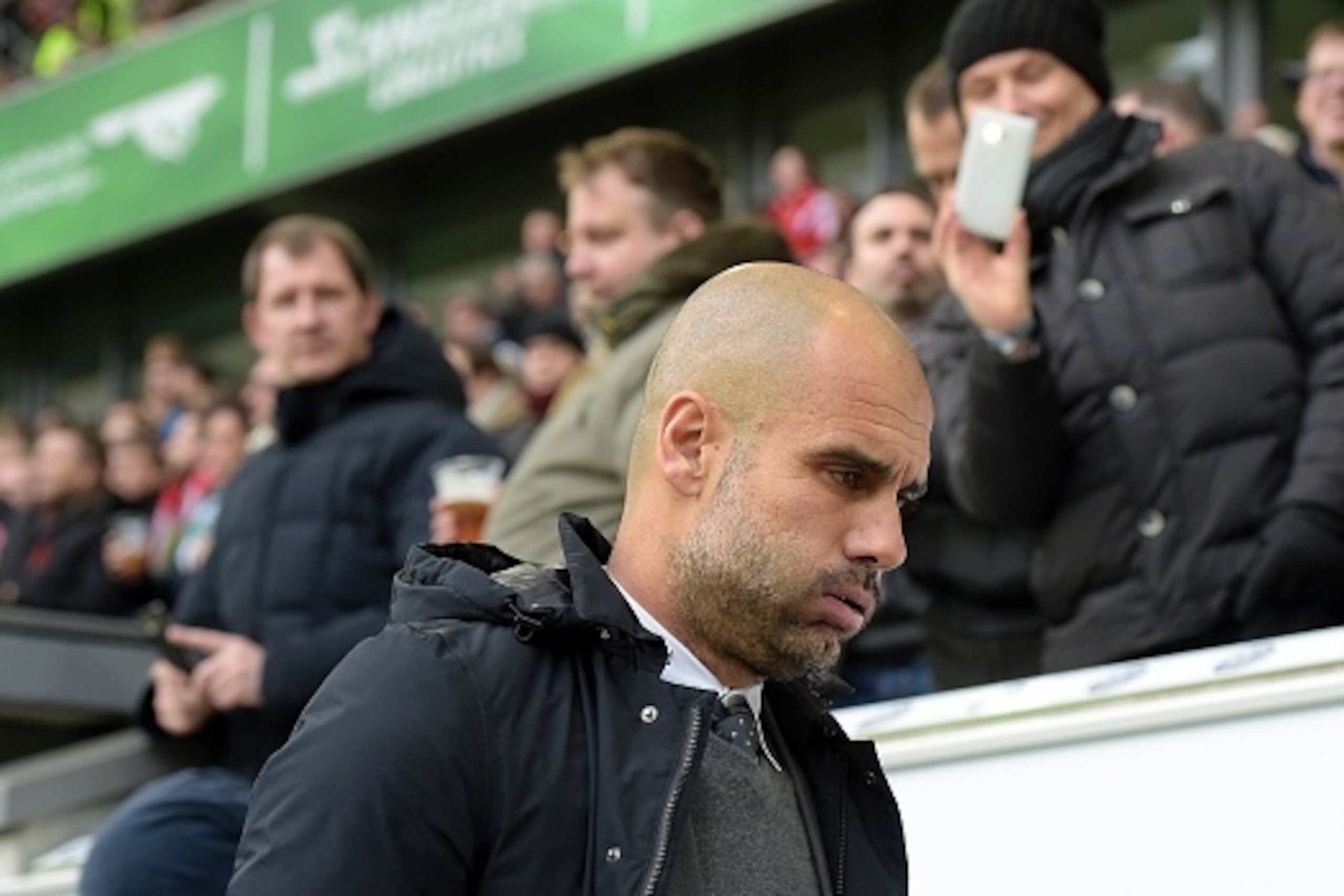 Bayern Munich's Spanish head coach Pep Guardiola arrives for the German first division Bundesliga football match VfL Wolfsburg vs FC Bayern Munich in Wolfsburg, northern Germany, on February 27, 2016. / AFP / TOBIAS SCHWARZ / RESTRICTIONS: DURING MATCH TI