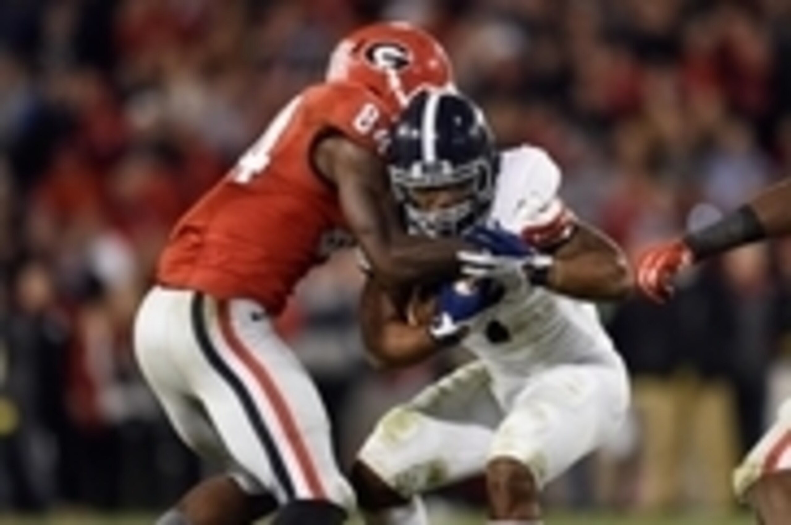 Nov 21, 2015; Athens, GA, USA; Georgia Southern Eagles running back LA Ramsby (1) is tackled by Georgia Bulldogs linebacker Leonard Floyd (84) during overtime at Sanford Stadium. Georgie defeated Georgia Southern 23-17 in overtime. Mandatory Credit: Dale 