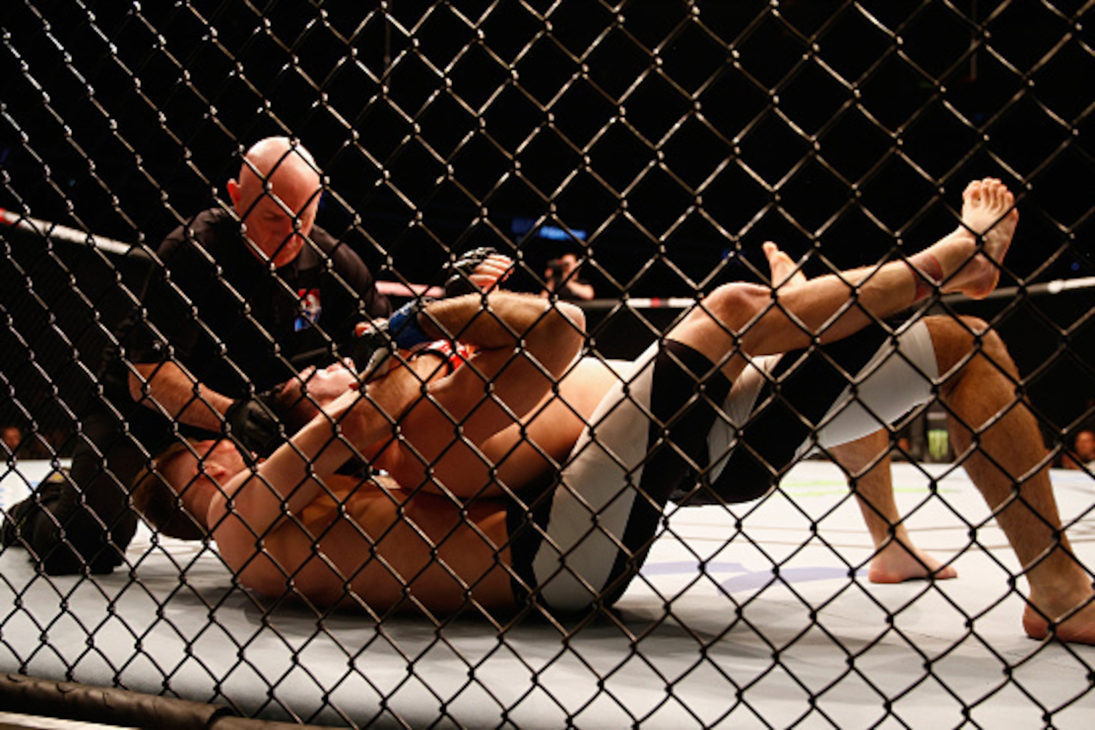 LONDON, ENGLAND - FEBRUARY 27:  Teemu Packalen of Finland holds Thibault Gouti of France into submission to win the fight during the Lightweight Bout of the UFC Fight Night  at The O2 Arena on February 27, 2016 in London, England.  (Photo by Christopher L
