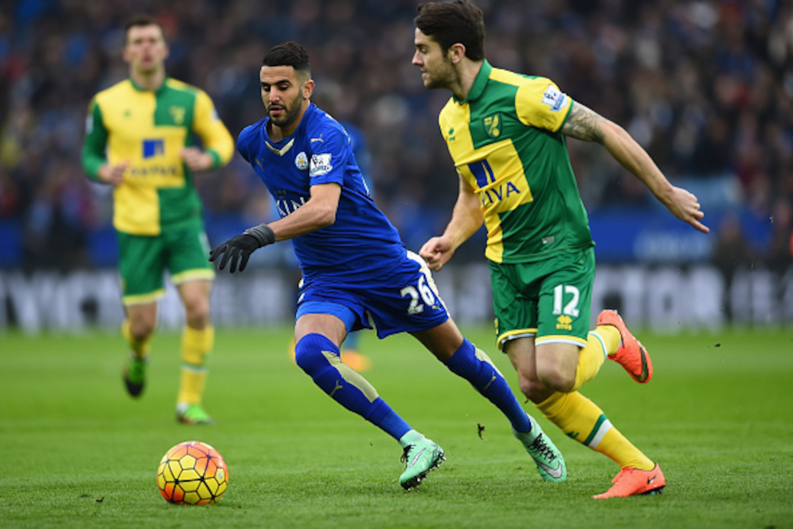 LEICESTER, ENGLAND - FEBRUARY 27: Riyad Mahrez of Leicester City battles with Robbie Brady of Norwich City during the Barclays Premier League match between Leicester City and Norwich City at The King Power Stadium on February 27, 2016 in Leicester, Englan