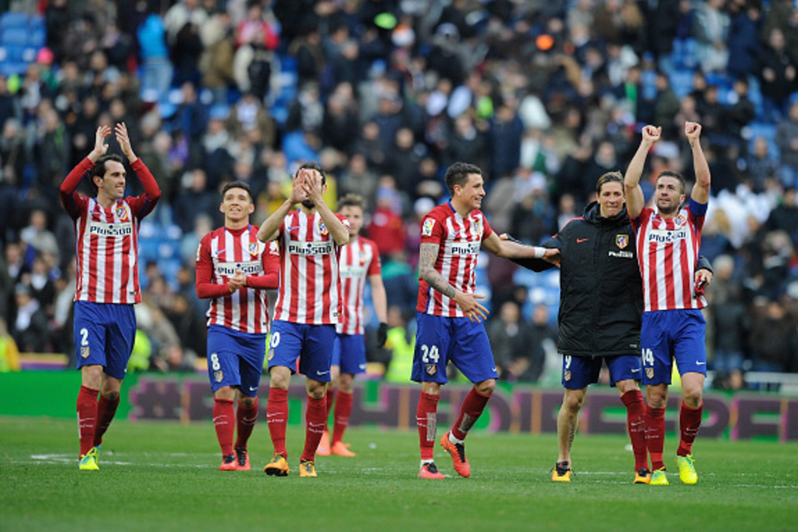 MADRID, SPAIN - FEBRUARY 27:  (From L to R) Diego Godin, Matias Kranevitter, Jose Maria Gimenez, Fernando Torres and Gabi Fernandez of Club Atletico de Madrid celebrate   after they beat Real 1-0 in the La Liga match between Real Madrid CF and Club Atleti