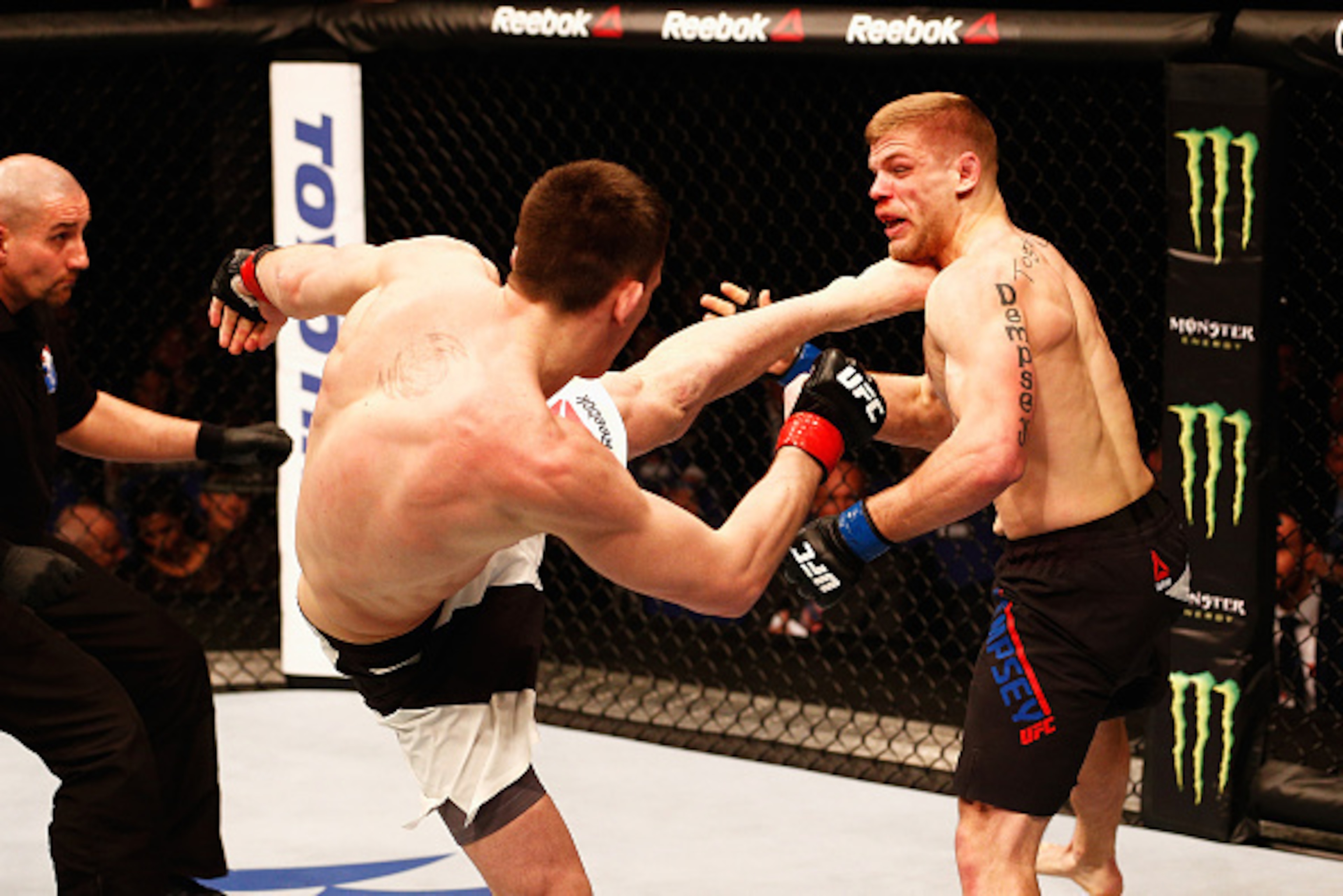 LONDON, ENGLAND - FEBRUARY 27:  Scott Askham of England (L) KO's Chris Dempsey of the USA with a high kick in their Middleweight bout during the UFC Fight Night held at at Indigo at The O2 Arena on February 27, 2016 in London, England.  (Photo by Dean Mou