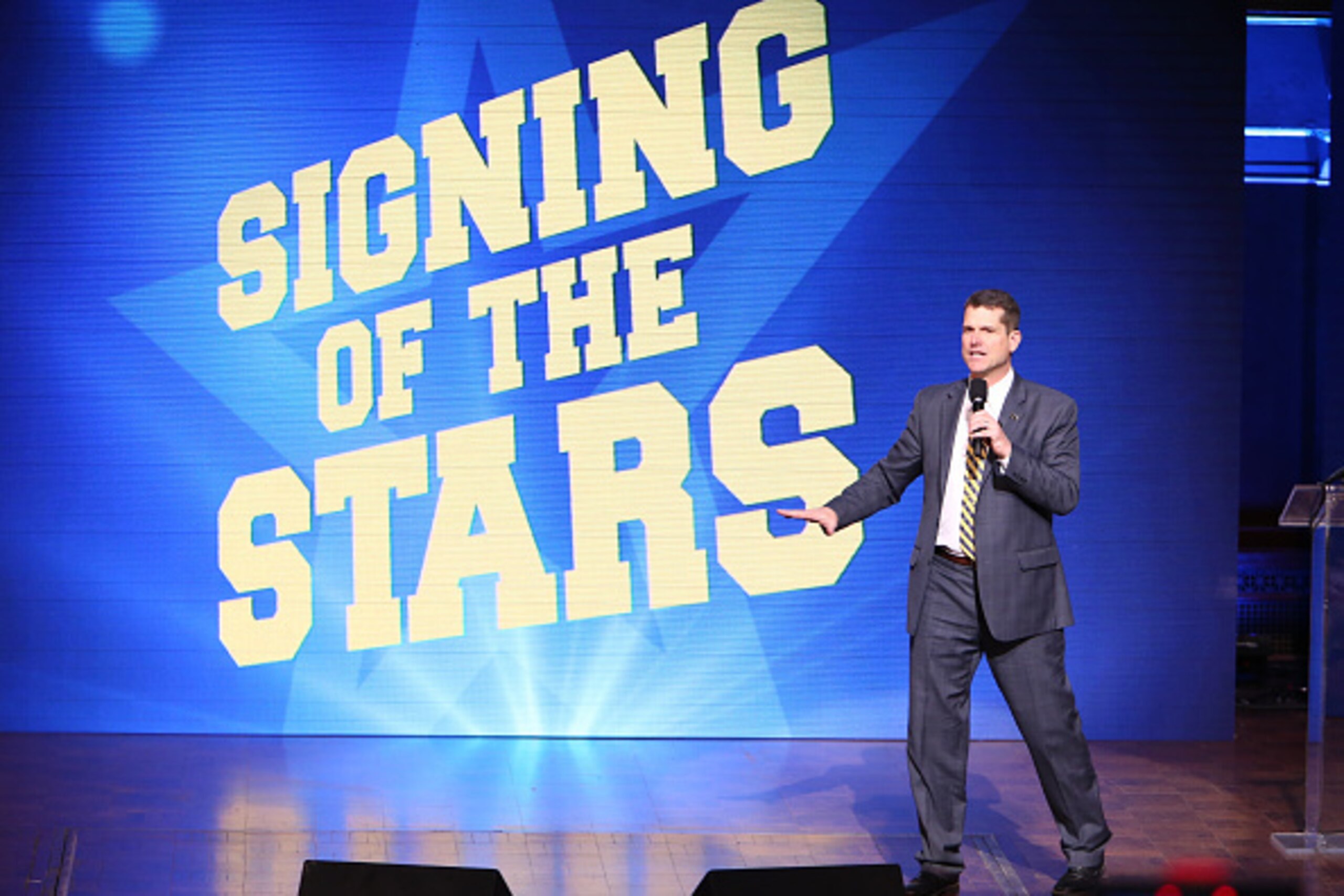 ANN ARBOR, MI - FEBRUARY  3:  Head coach Jim Harbaugh of the Michigan Wolverines speaks during the Michigan Signing of the Stars event at Hill Auditorium on February 3, 2016 in Ann Arbor, Michigan. (Photo by Rey Del Rio/Getty Images)