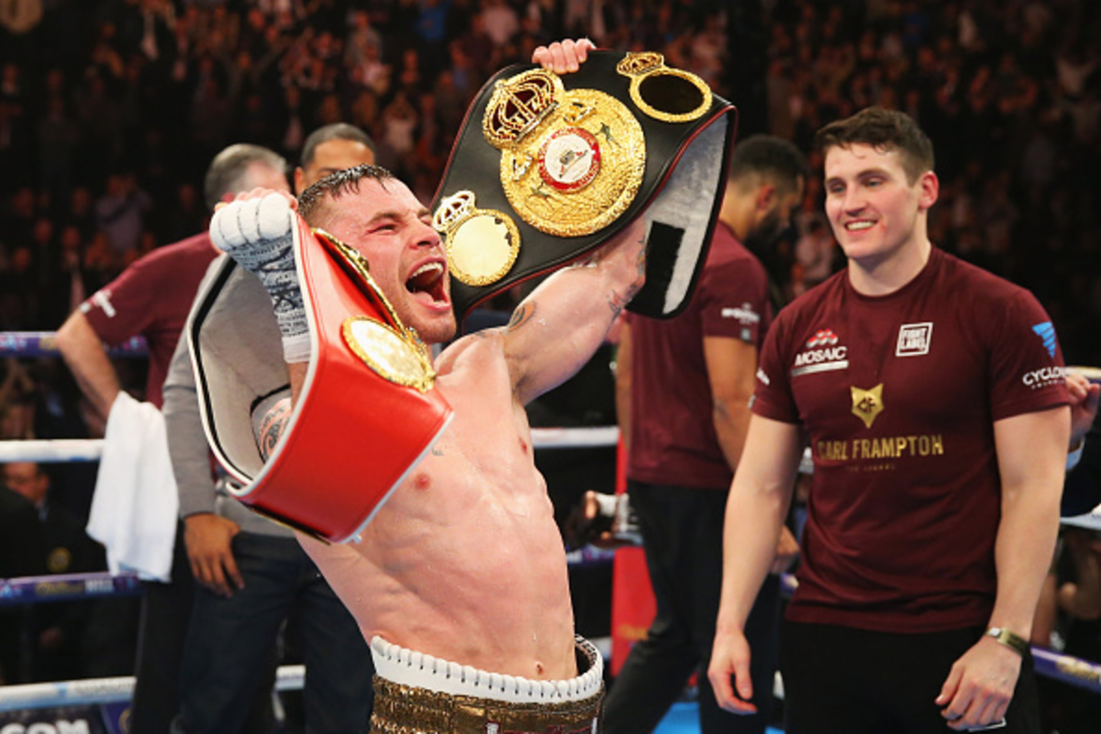 MANCHESTER, ENGLAND - FEBRUARY 27:  Carl Frampton celebrates with belts after a points victory over Scott Quigg after their World Super-Bantamweight title contest at Manchester Arena on February 27, 2016 in Manchester, England. Frampton's victory united t