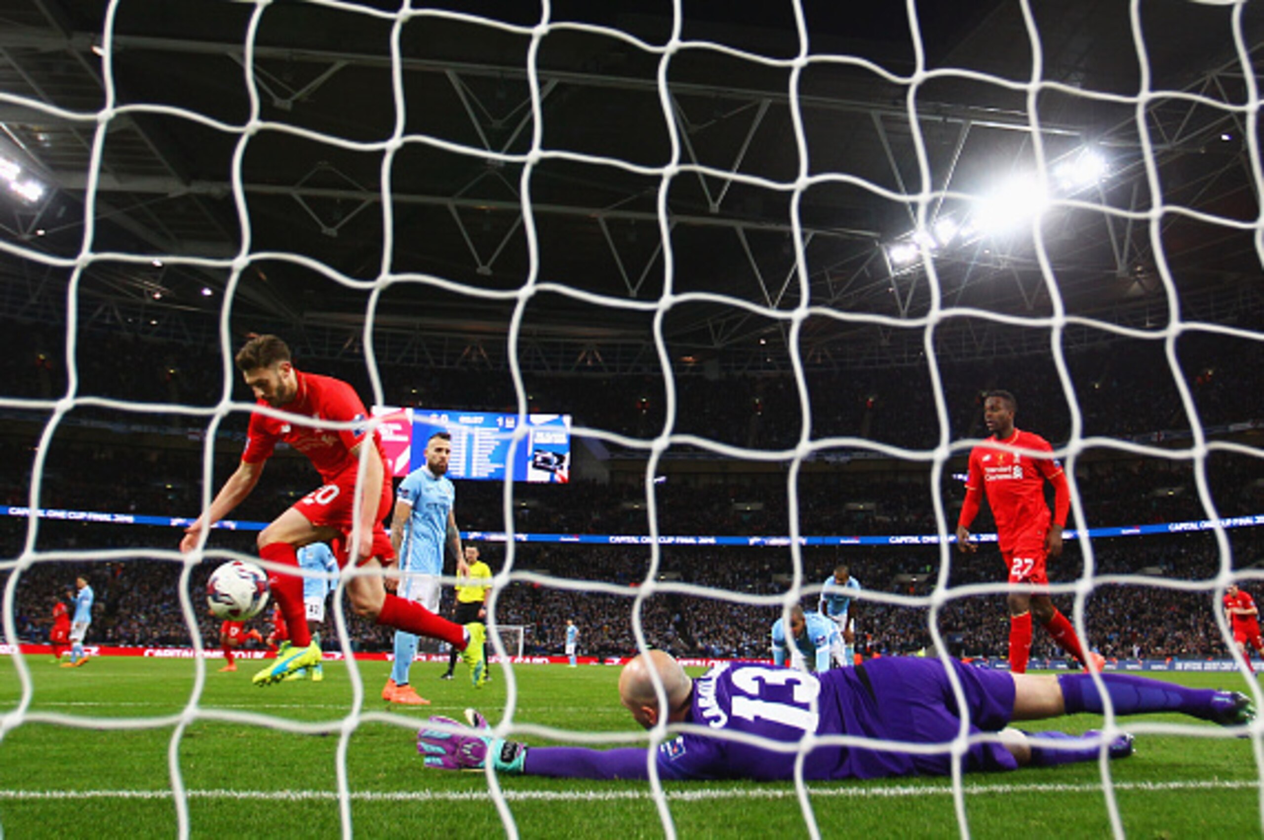 LONDON, ENGLAND - FEBRUARY 28:  Goalkeeper Willy Caballero of Manchester City reacts as Adam Lallana of Liverpool (20) celebrates their equalising goal by Philippe Coutinho during the Capital One Cup Final match between Liverpool and Manchester City at We