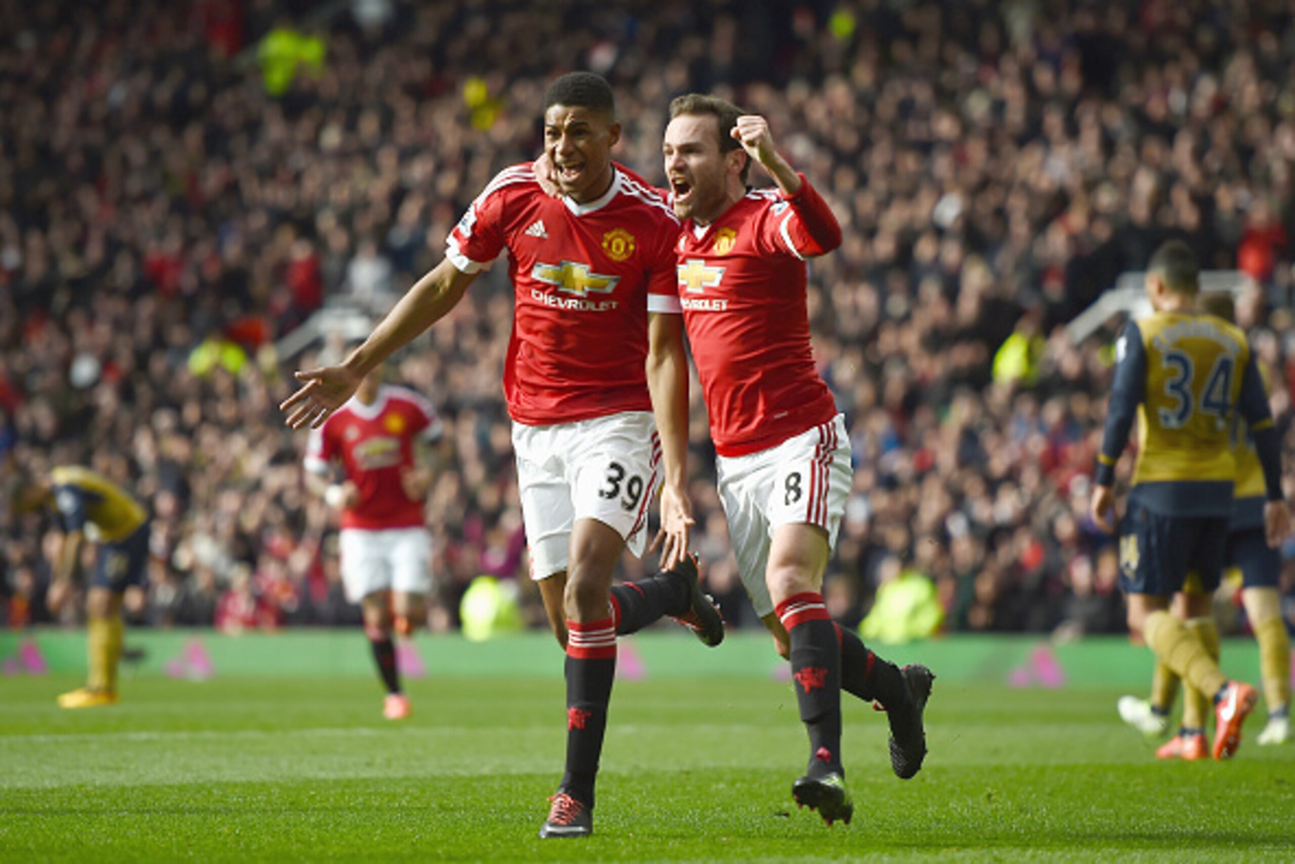 MANCHESTER, ENGLAND - FEBRUARY 28: Marcus Rashford of Manchester United celebrates scoring his opening goal with Juan Mata (R) during the Barclays Premier League match between Manchester United and Arsenal at Old Trafford on February 28, 2016 in Mancheste MANCHESTER, ENGLAND - FEBRUARY 28: Marcus Rashford of Manchester United celebrates scoring his opening goal with Juan Mata (R) during the Barclays Premier League match between Manchester United and Arsenal at Old Trafford on February 28, 2016 in Mancheste