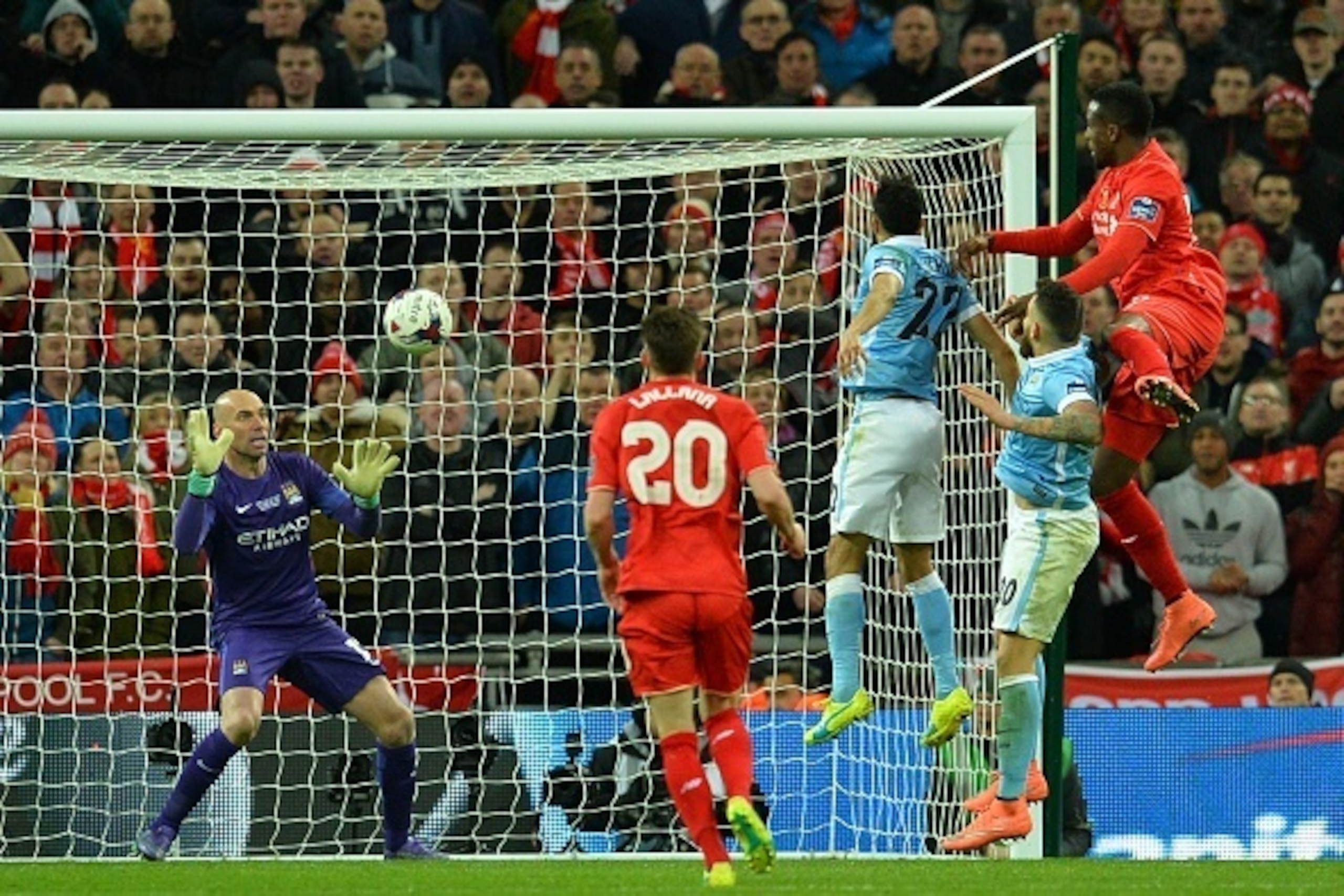 Manchester CIty's Argentinian goalkeeper Willy Caballero (L) saves a header from Liverpool's Belgian striker Divock Origi (R) during the English League Cup final football match between Liverpool and Manchester City at Wembley Stadium in London on February