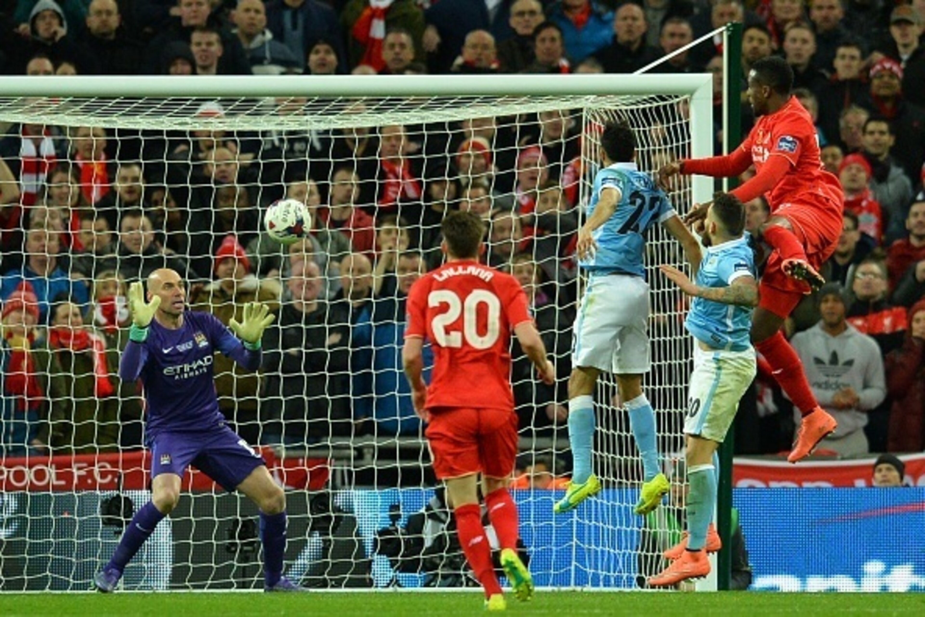 Manchester CIty's Argentinian goalkeeper Willy Caballero (L) saves a header from Liverpool's Belgian striker Divock Origi (R) during the English League Cup final football match between Liverpool and Manchester City at Wembley Stadium in London on February Manchester CIty's Argentinian goalkeeper Willy Caballero (L) saves a header from Liverpool's Belgian striker Divock Origi (R) during the English League Cup final football match between Liverpool and Manchester City at Wembley Stadium in London on February