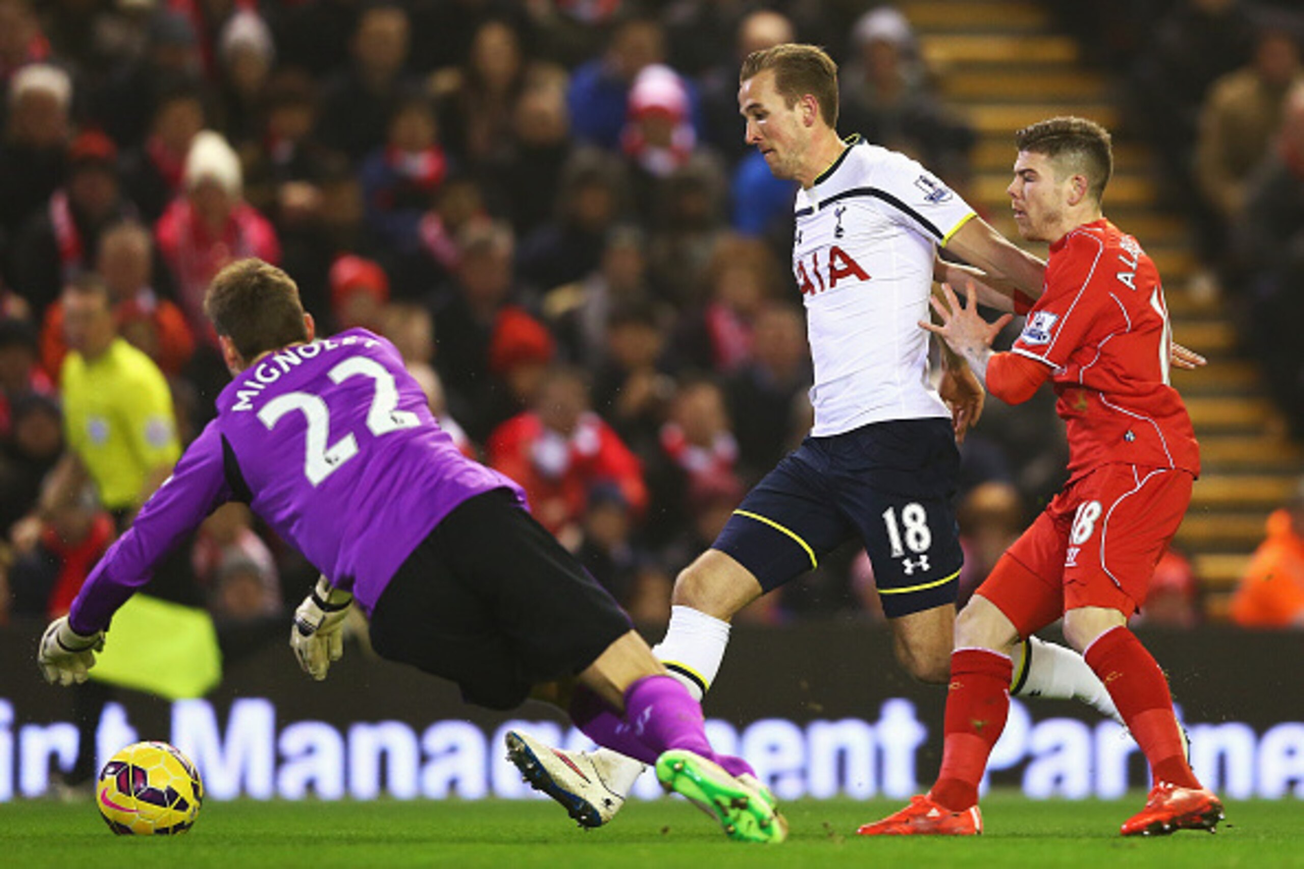 LIVERPOOL, ENGLAND - FEBRUARY 10: Harry Kane of Tottenham Hotspur challenges for the ball with Simon Mignolet and Alberto Moreno of Liverpool during the Barclays Premier League match between Liverpool and Tottenham Hotspur at Anfield on February 10, 2015 