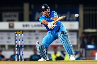 India's T20 cricket captain Mahendra Singh Dhoni plays a shot during the second Twenty20 (T20) international match between India and Sri Lanka at the Jharkhand State Cricket Association International Stadium Complex in Ranchi on February 12, 2016.  / AFP 