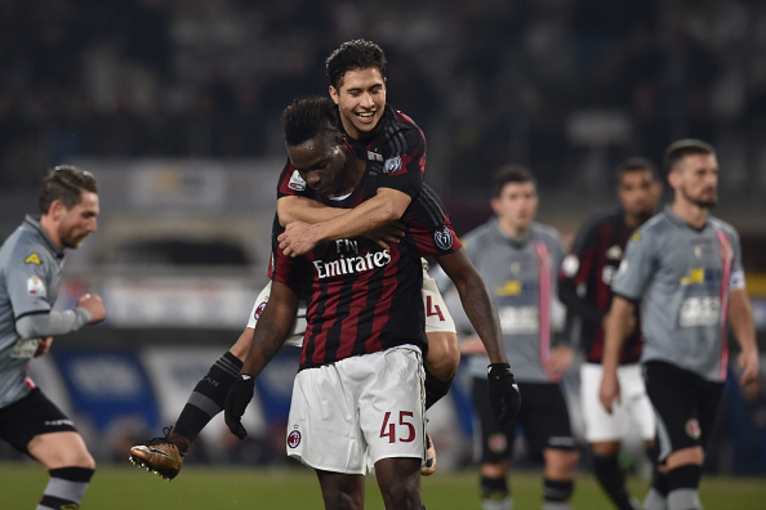 TURIN, ITALY - JANUARY 26:  Mario Balotelli (C) of AC Milan celebrates after scoring the opening goal from the penalty spot with team mate  Jose Mauri during the TIM Cup match between US Alessandria and AC Milan at Olimpico Stadium on January 26, 2016 in 