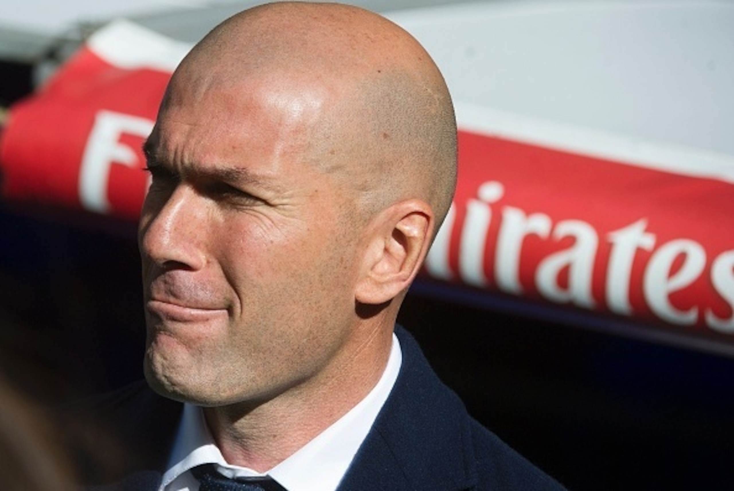 Real Madrid's French coach Zinedine Zidane gestures before the start of the Spanish league football match Real Madrid CF vs Club Atletico de Madrid at the Santiago Bernabeu stadium in Madrid on February 27, 2016. / AFP / CURTO DE LA TORRE        (Photo cr