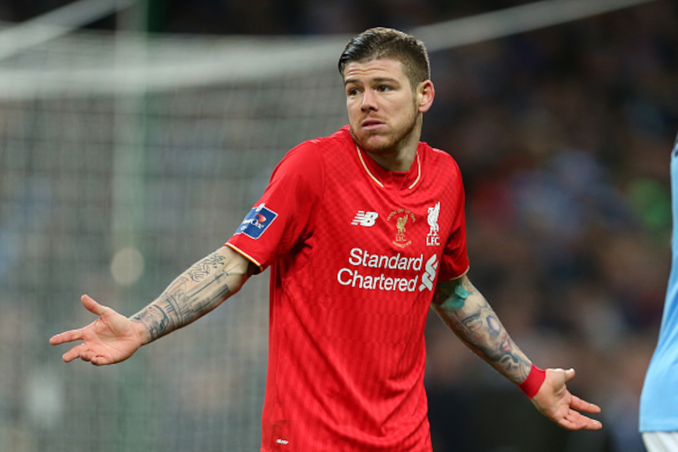 LONDON, ENGLAND - FEBRUARY 28 :  Alberto Moreno of Liverpool shrugs his shoulders during the Capital One Cup Final match between Liverpool and Manchester City at Wembley Stadium on February 28, 2016 in London, England.  (Photo by Catherine Ivill - AMA/Get