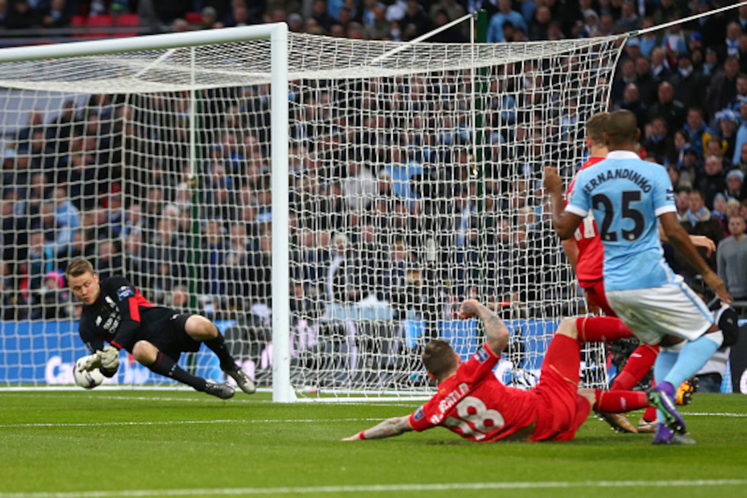 LONDON, ENGLAND - FEBRUARY 28 :  Fernandinho of Manchester City scores a goal past Liverpool goalkeeper Simon Mignolet to make it 0-1 during the Capital One Cup Final match between Liverpool and Manchester City at Wembley Stadium on February 28, 2016 in L