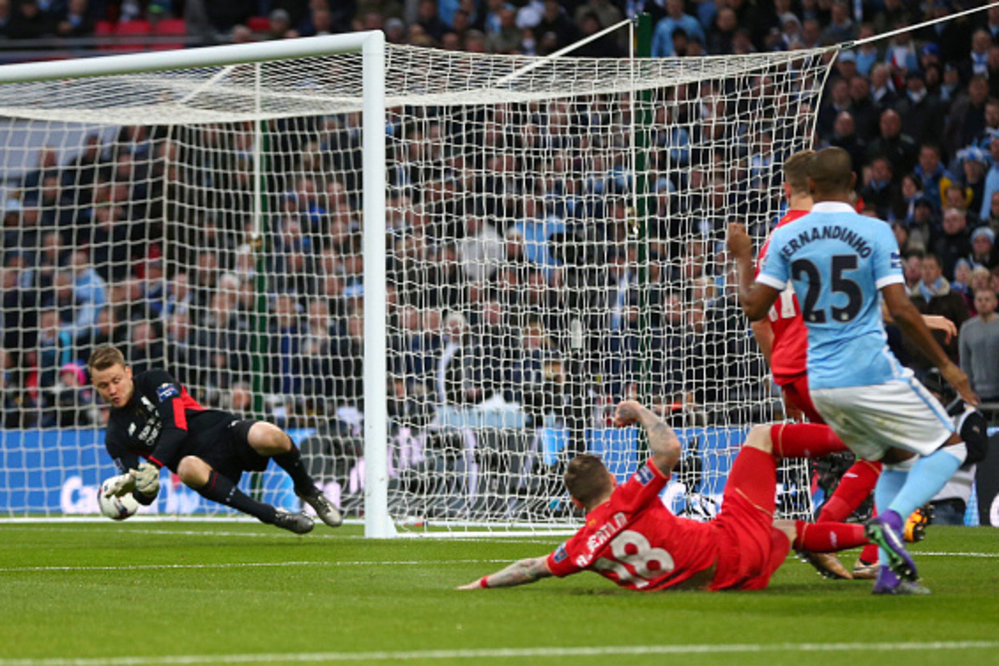 LONDON, ENGLAND - FEBRUARY 28 :  Fernandinho of Manchester City scores a goal past Liverpool goalkeeper Simon Mignolet to make it 0-1 during the Capital One Cup Final match between Liverpool and Manchester City at Wembley Stadium on February 28, 2016 in L