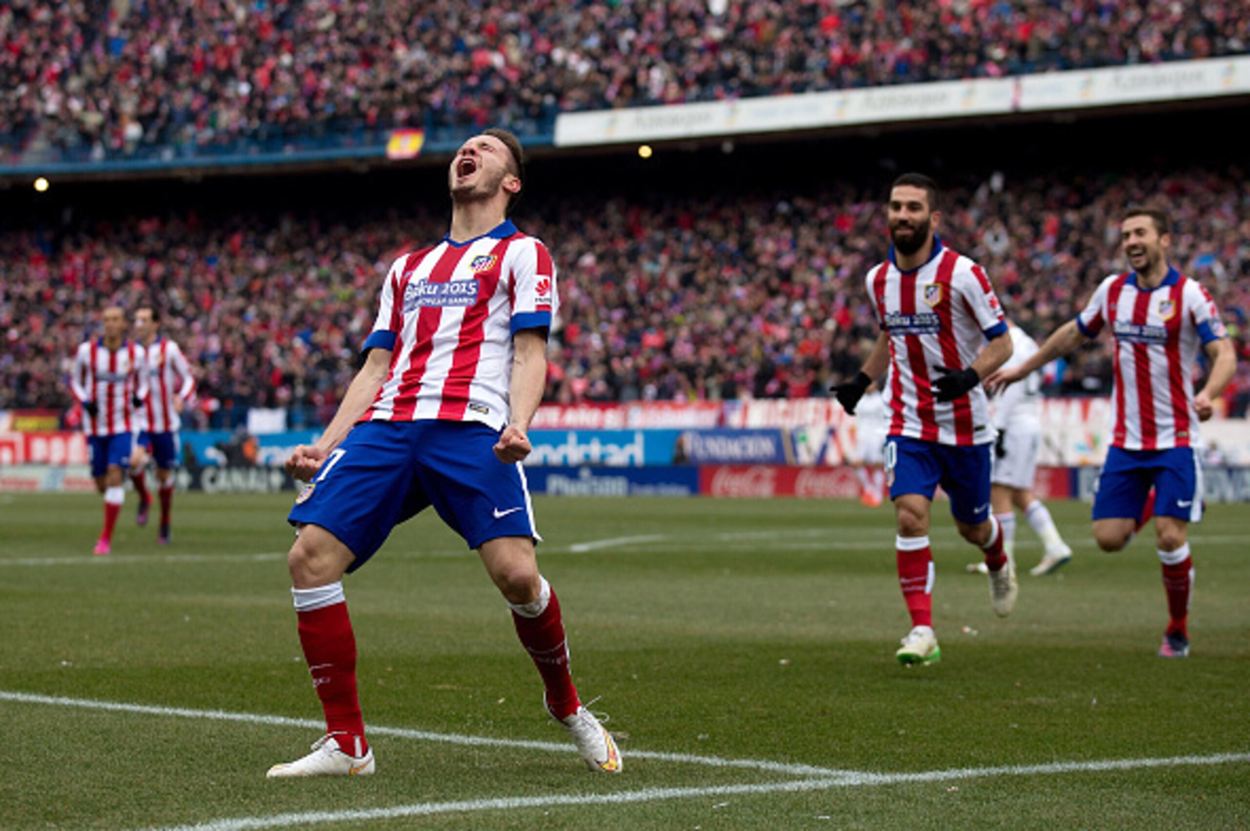 MADRID, SPAIN - FEBRUARY 07:  Saul Niguez of Atletico de Madrid celebrates scoring their second goal during the La Liga match between Club Atletico de Madrid and Real Madrid CF at Vicente Calderon Stadium on February 7, 2015 in Madrid, Spain.  (Photo by G