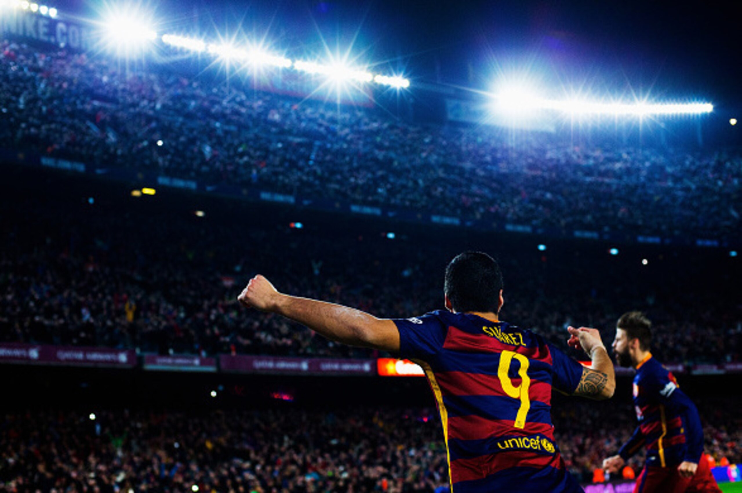 BARCELONA, SPAIN - FEBRUARY 28: Luis Suarez of Barcelona celebrates his team's second goal scored by Gerard Pique (R) during the La Liga match between FC Barcelona and Sevilla FC at Camp Nou on February 28, 2016 in Barcelona, Spain.  (Photo by Vladimir Ry