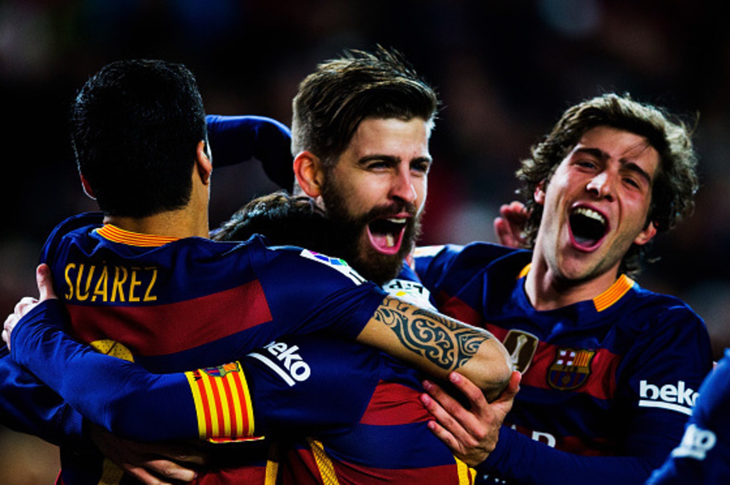 BARCELONA, SPAIN - FEBRUARY 28:  Gerard Pique of Barcelona is celebrated by his team after scoring his team's second goal during the La Liga match between FC Barcelona and Sevilla FC at Camp Nou on February 28, 2016 in Barcelona, Spain.  (Photo by Vladimi