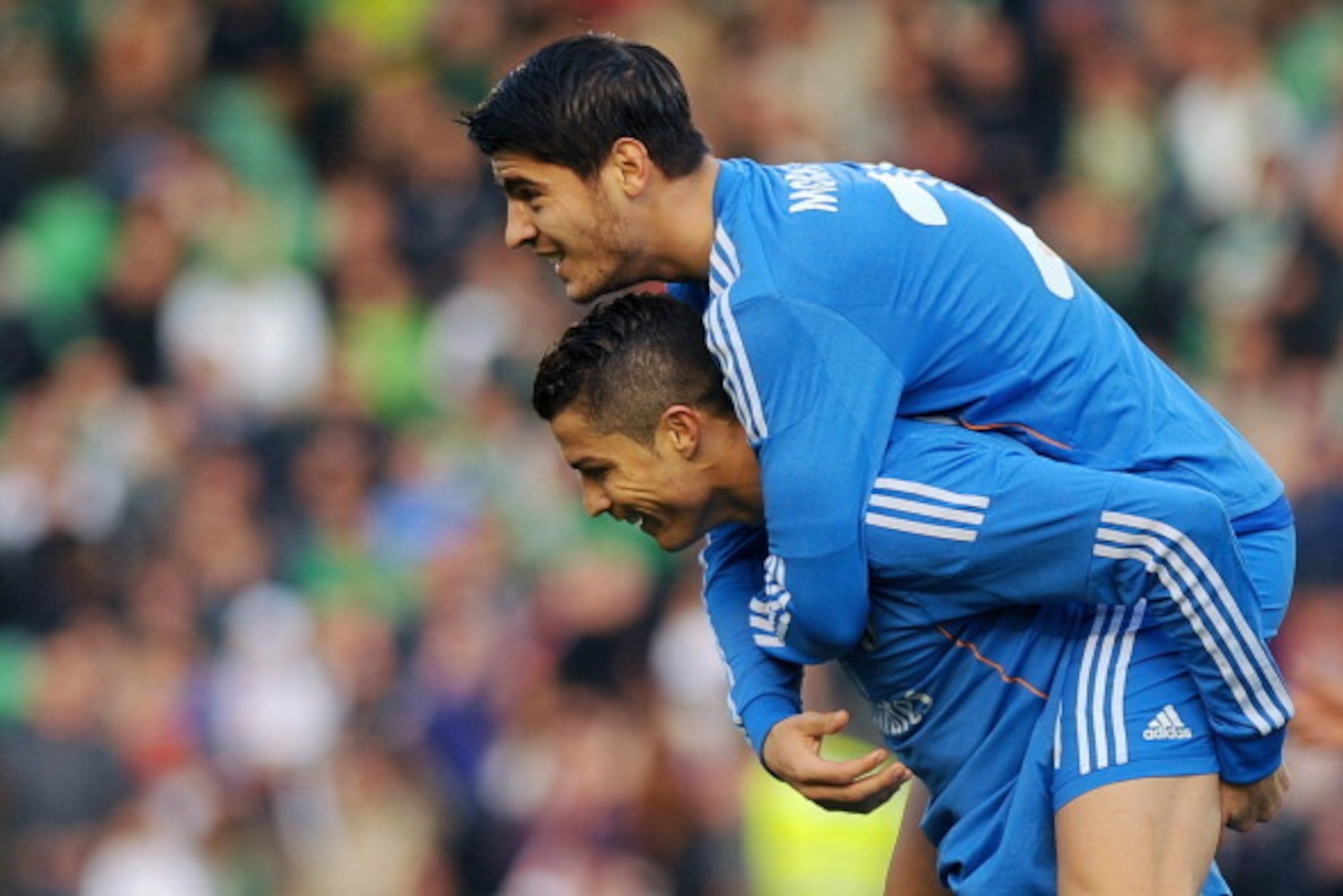 Real Madrid's forward Alvaro Morata (L) celebrates with Portuguese forward Cristiano Ronaldo after scoring during the Spanish league football match Real Betis vs Real Madrid on January 18, 2014 at the Benito Villamarin stadium in Sevilla. AFP PHOTO/ JORGE