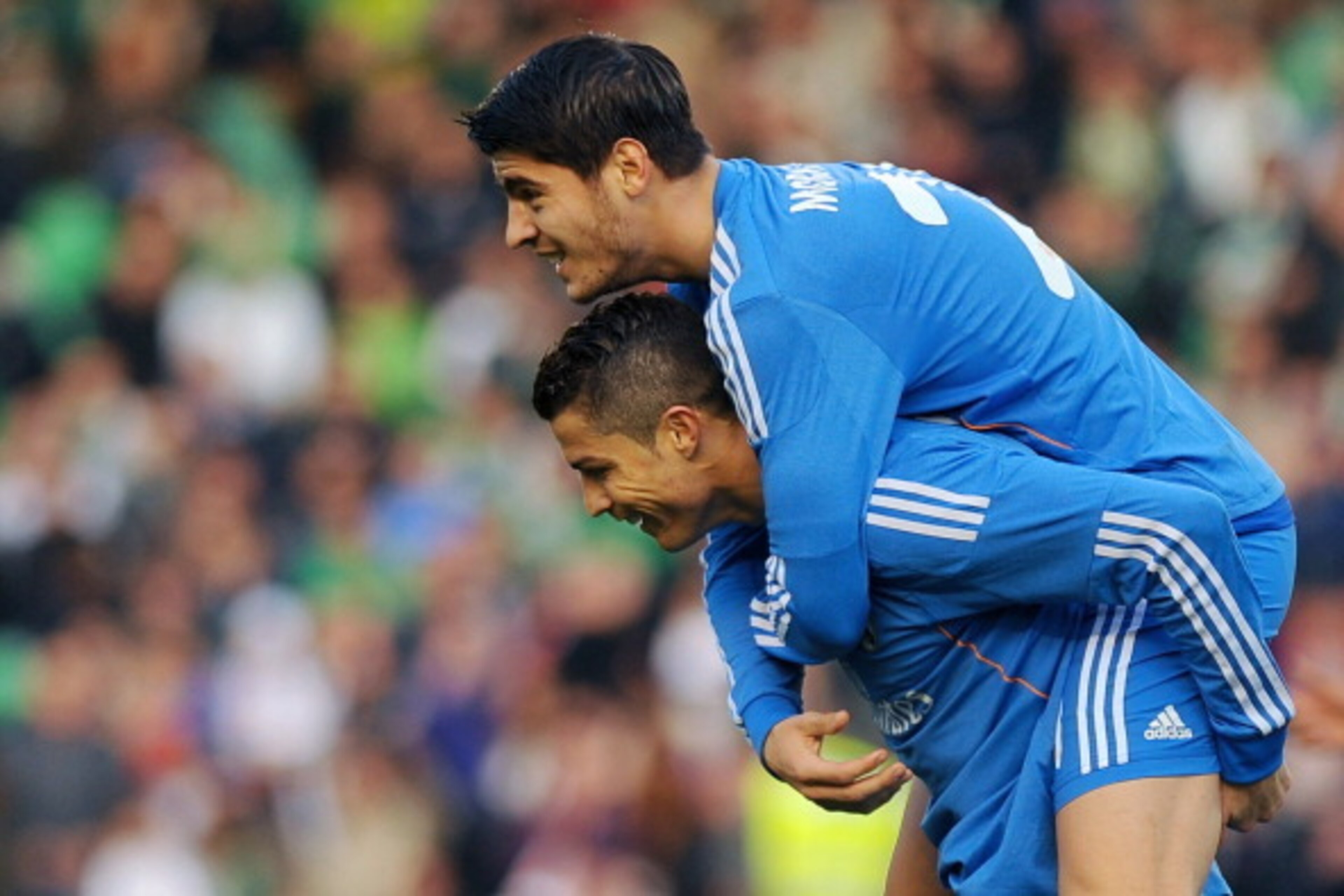 Real Madrid's forward Alvaro Morata (L) celebrates with Portuguese forward Cristiano Ronaldo after scoring during the Spanish league football match Real Betis vs Real Madrid on January 18, 2014 at the Benito Villamarin stadium in Sevilla. AFP PHOTO/ JORGE