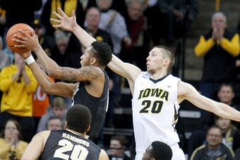 IOWA CITY, IA - JANUARY 24:  Forward Jarrod Uthoff #20 of the Iowa Hawkeyes defends against forward Vince Edwards #12 of the Purdue Boilermakers, in the first half on January 24, 2016 at Carver-Hawkeye Arena, in Iowa City, Iowa.  (Photo by Matthew Holst/G