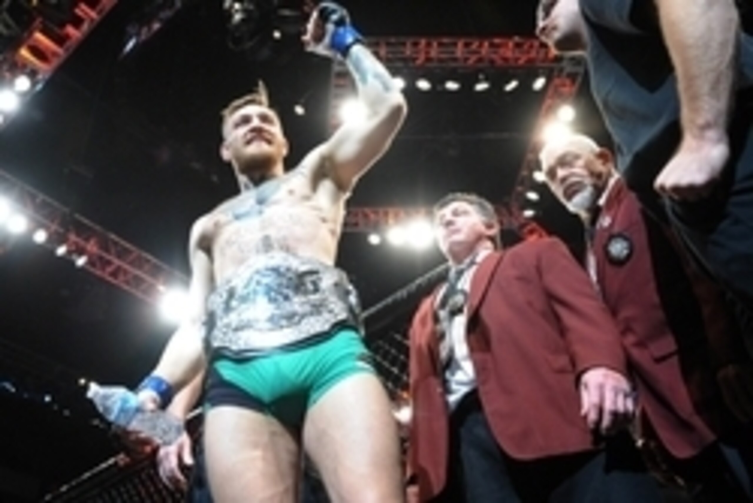 December 12, 2015; Las Vegas, NV, USA; Conor McGregor exits the octagon following his championship victory against Jose Aldo during UFC 194 at MGM Grand Garden Arena. Mandatory Credit: Gary A. Vasquez-USA TODAY Sports