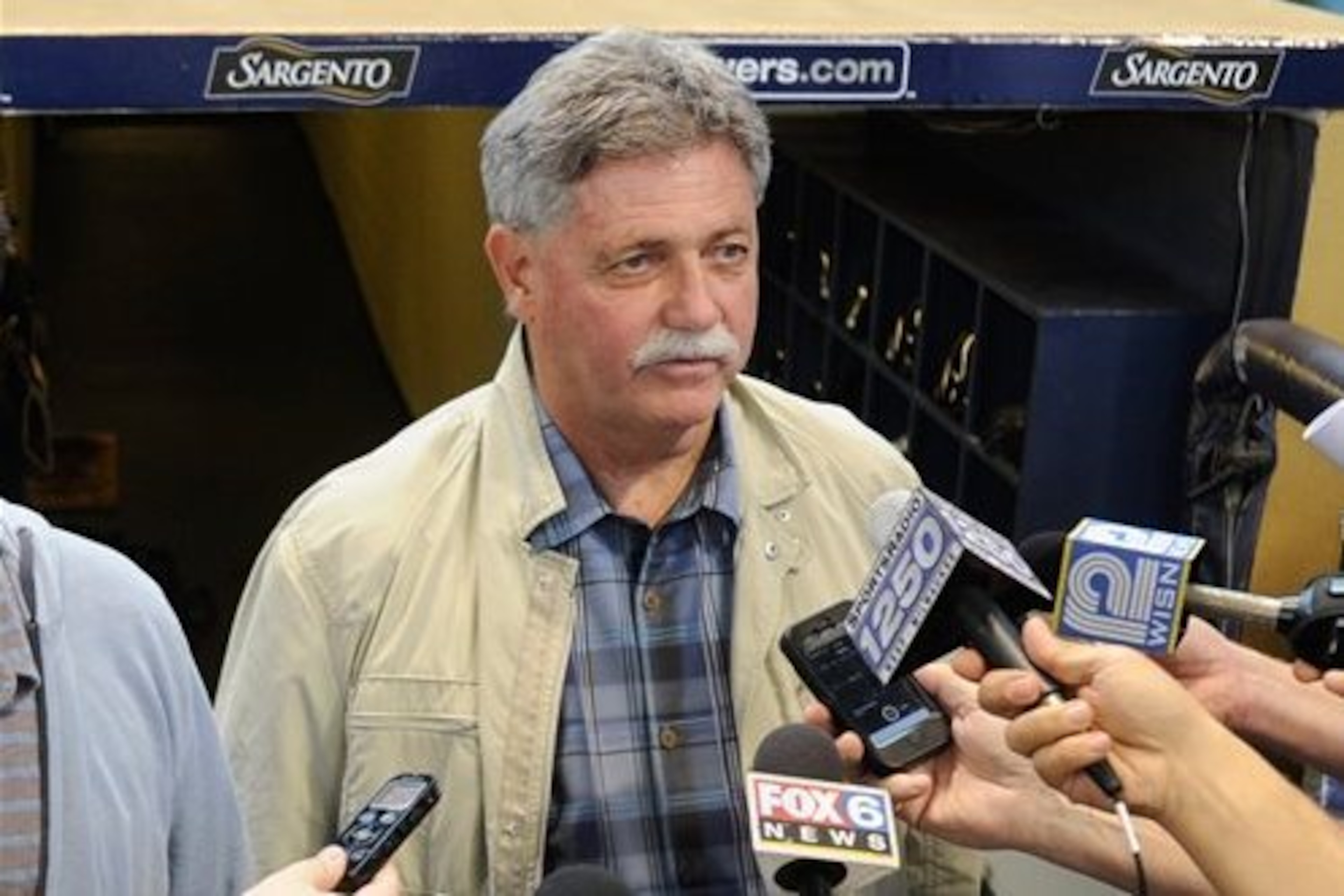 Former Brewers GM Doug Melvin called Denson's father to tell him the team wouldn't treat his son any differently whether he was gay or not.
