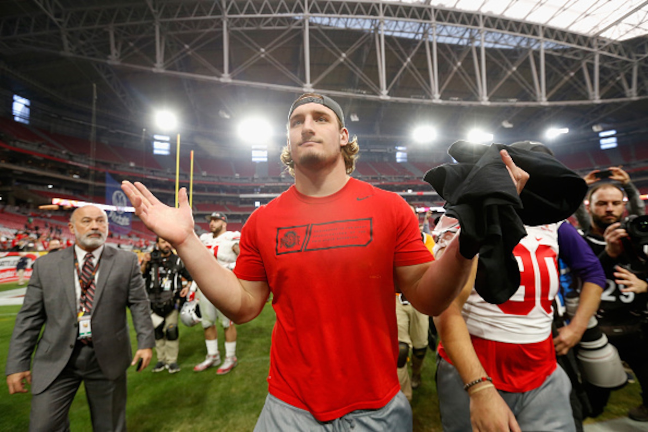 GLENDALE, AZ - JANUARY 01:  Defensive lineman Joey Bosa #97 of the Ohio State Buckeyes reacts as he walks off the field after defeating the Notre Dame Fighting Irish 44-28 in the BattleFrog Fiesta Bowl at University of Phoenix Stadium on January 1, 2016 i