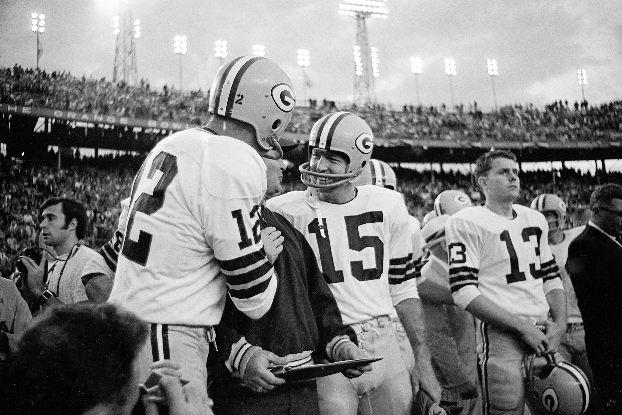 Jan. 14, 1968; Miami, FL, USA; FILE PHOTO; Green Bay Packers quarterbacks Zeke Bratkowski (12) and Bart Starr (15) celebrate near the end of Super Bowl II against the Oakland Raiders at the Orange Bowl. The Packers defeated the Raiders 33-14. Mandatory Cr Jan. 14, 1968; Miami, FL, USA; FILE PHOTO; Green Bay Packers quarterbacks Zeke Bratkowski (12) and Bart Starr (15) celebrate near the end of Super Bowl II against the Oakland Raiders at the Orange Bowl. The Packers defeated the Raiders 33-14. Mandatory Cr