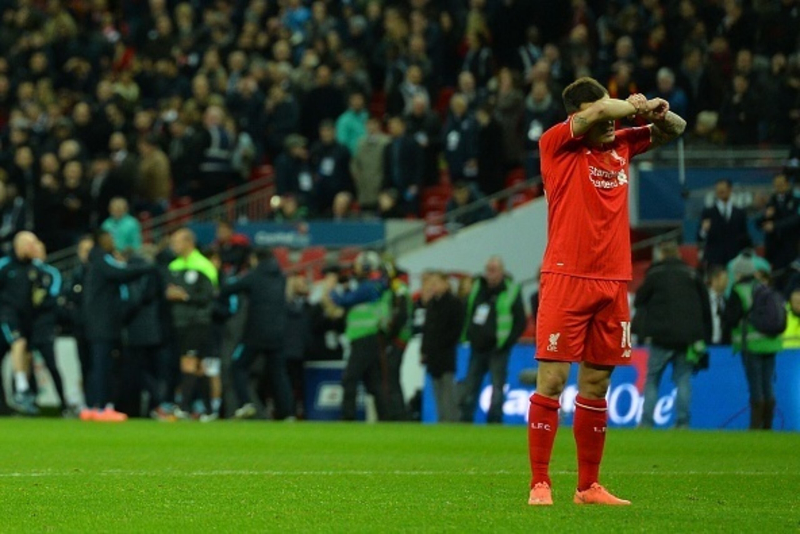 Liverpool's Brazilian midfielder Philippe Coutinho reacts after his penalty gets saved during the penalty shoot-out in the English League Cup final football match between Liverpool and Manchester City at Wembley Stadium in London on February 28, 2016. / A