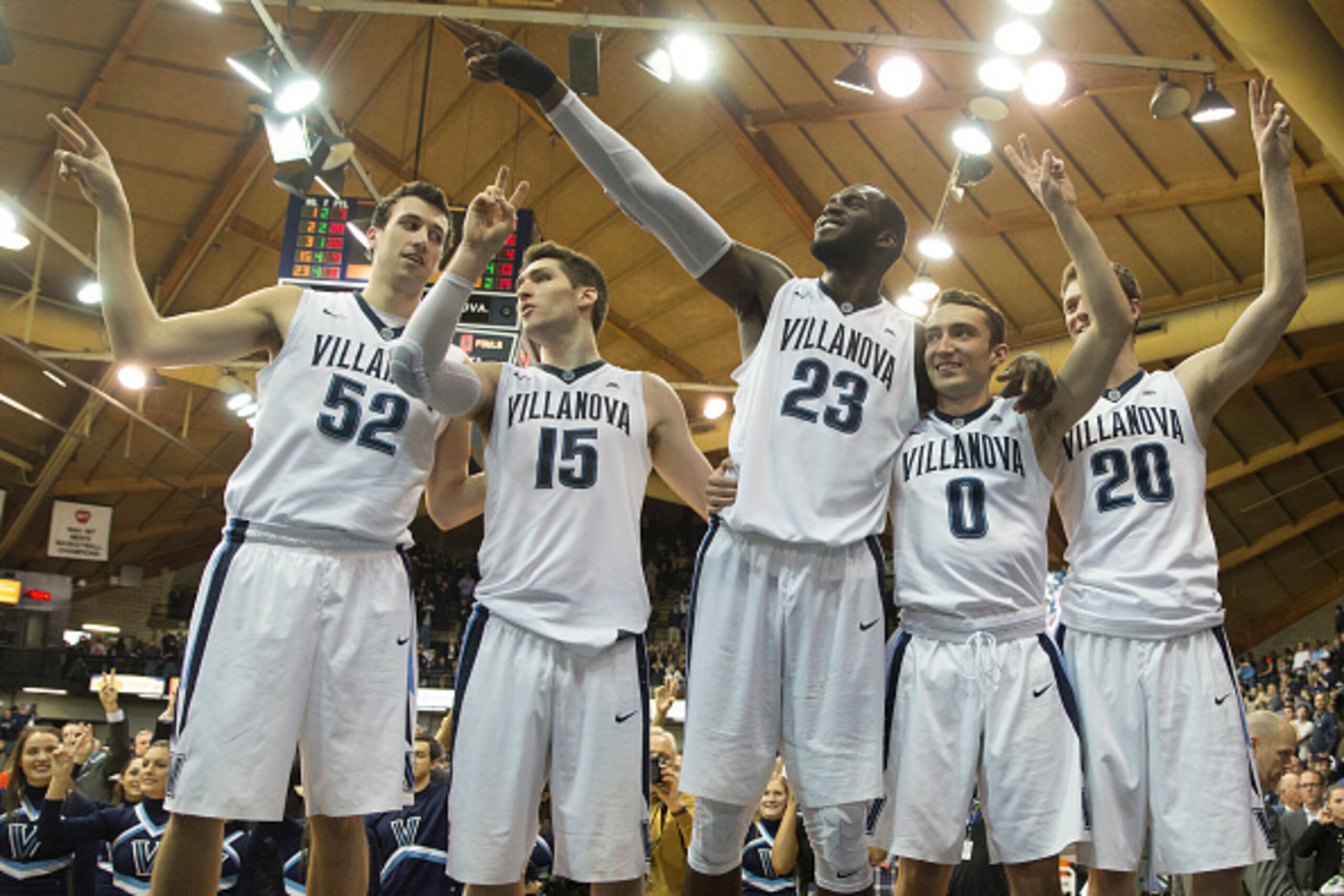 VILLANOVA, PA - FEBRUARY 20: Seniors Kevin Rafferty #52, Ryan Arcidiacono #15, Daniel Ochefu #23, Henry Lowe #0, and Patrick Farrell #20 of the Villanova Wildcats salute the student section at the end of the game against the Butler Bulldogs on February 20