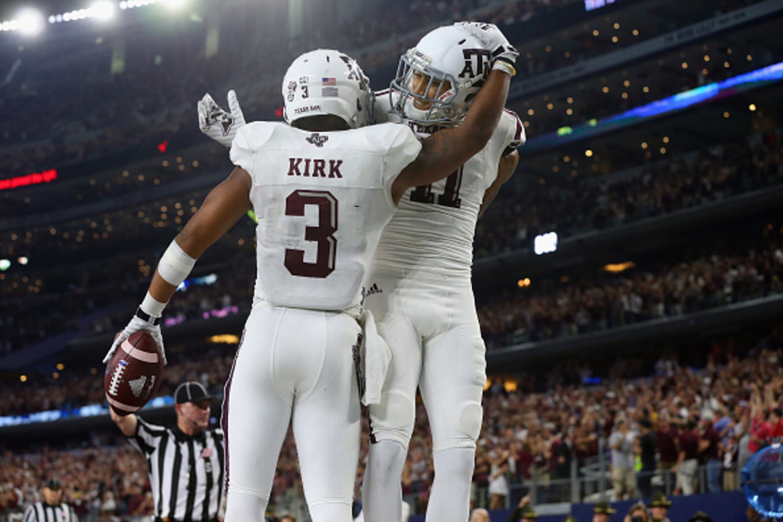 ARLINGTON, TX - SEPTEMBER 26:  Christian Kirk #3 of the Texas A&M Aggies celebrates the game winning touchdown with Josh Reynolds #11 against the Arkansas Razorbacks in overtime during the Southwest Classic at AT&T Stadium on September 26, 2015 in Arlingt
