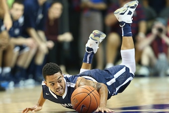 DALLAS, TX - NOVEMBER 30:  Justin Robinson #12 of the Monmouth Hawks at Moody Coliseum on November 30, 2014 in Dallas, Texas.  (Photo by Ronald Martinez/Getty Images)