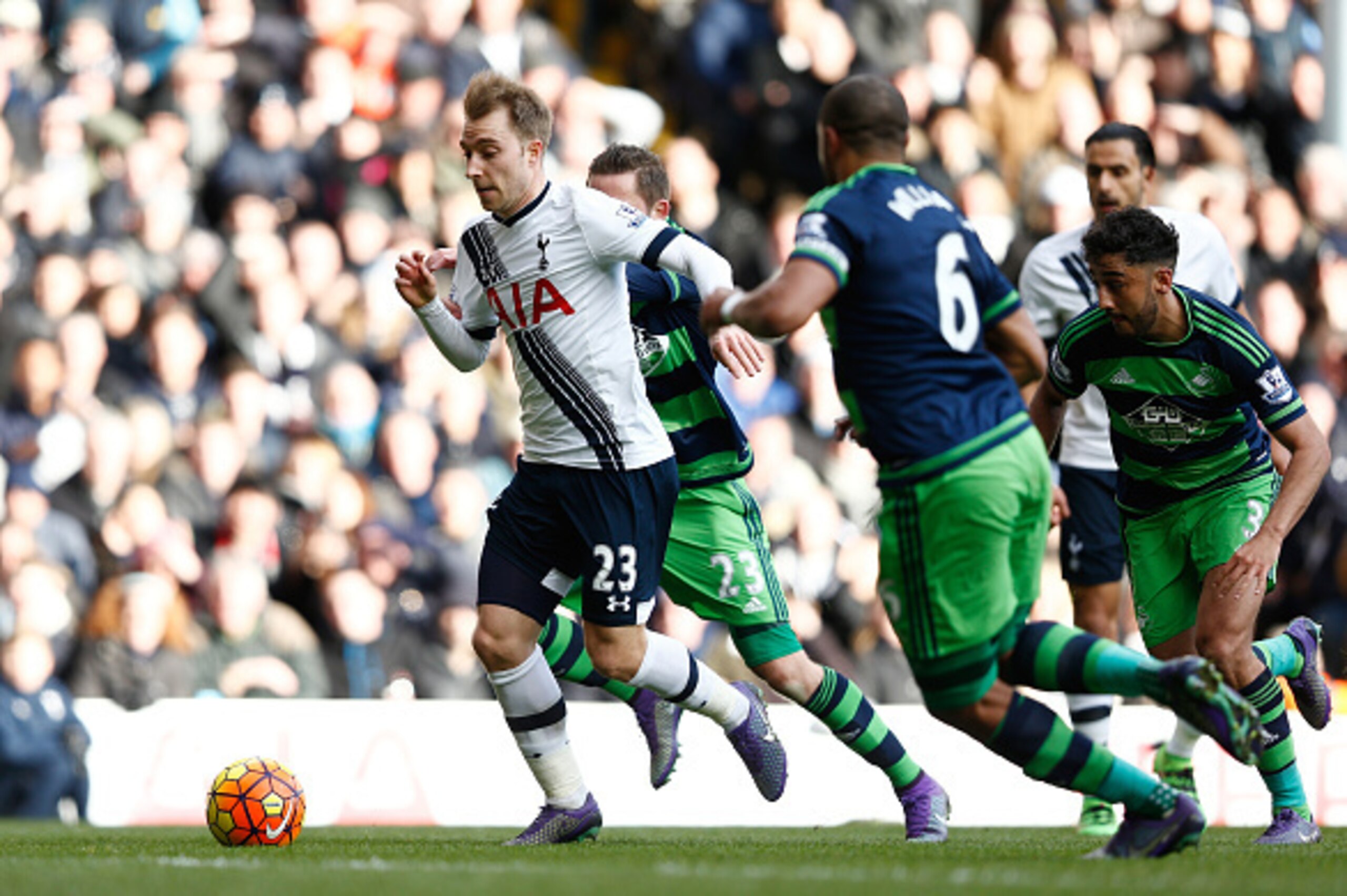 LONDON, ENGLAND - FEBRUARY 28: Christian Eriksen of Tottenham Hotspur makes a break during the Barclays Premier League match between Tottenham Hotspur and Swansea City at White Hart Lane on February 28, 2016 in London, England.  (Photo by Dean Mouhtaropou