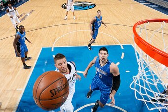 DALLAS, TX - MARCH 1: Chandler Parsons #25 of the Dallas Mavericks goes in for the lay up against the Orlando Magic on March 1, 2016 at the American Airlines Center in Dallas, Texas. NOTE TO USER: User expressly acknowledges and agrees that, by downloadin