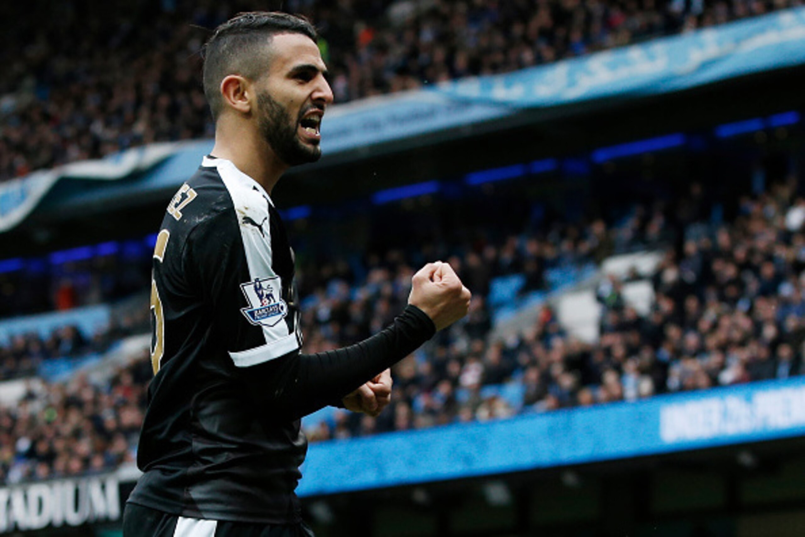 Leicester City's Algerian midfielder Riyad Mahrez celebrates  after scoring his team's second goal during the English Premier League football match between Manchester City and Leicester City at the Etihad Stadium in Manchester, north west England, on Febr