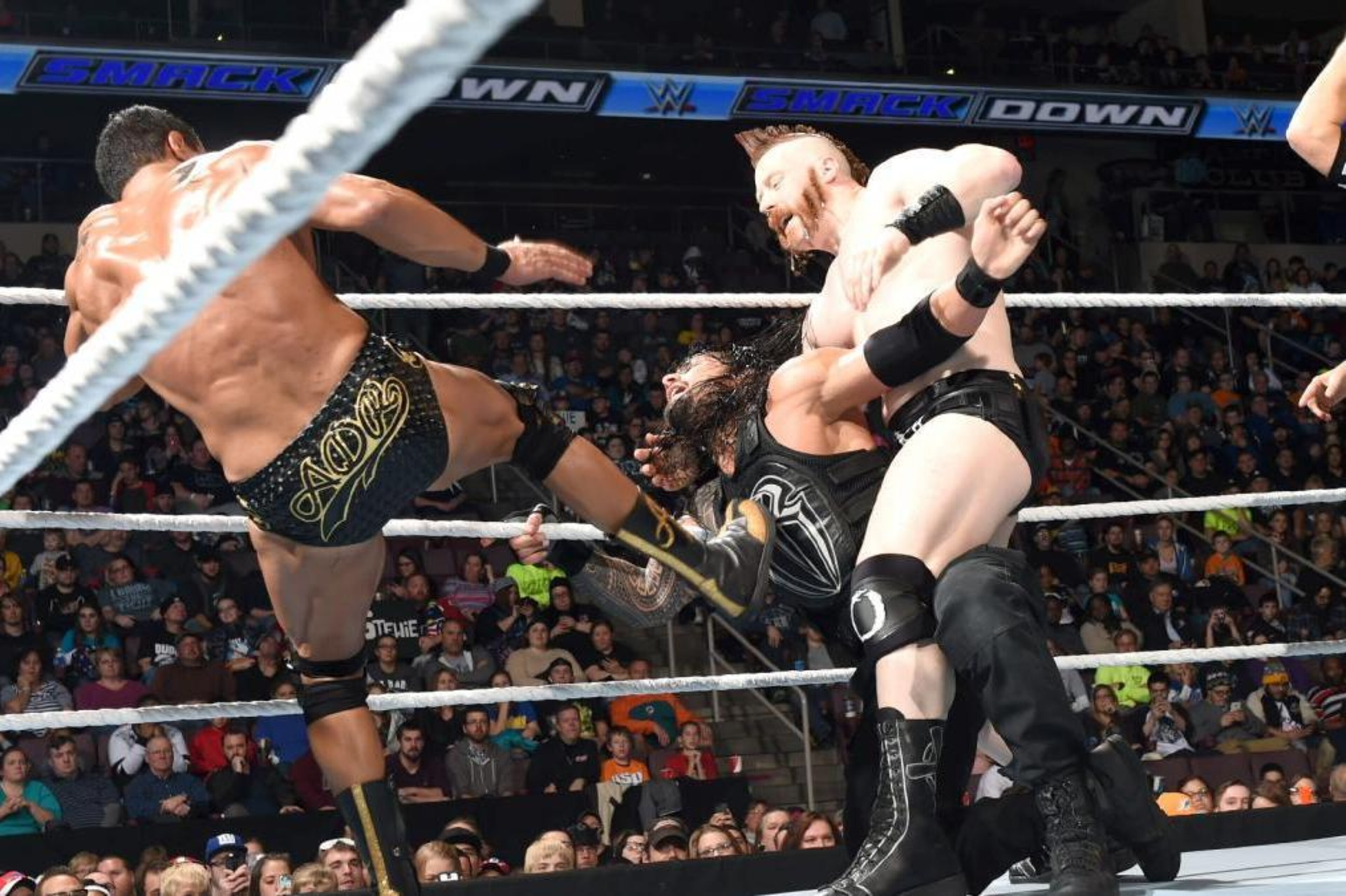 Alberto Del Rio and Sheamus attack Roman Reigns.