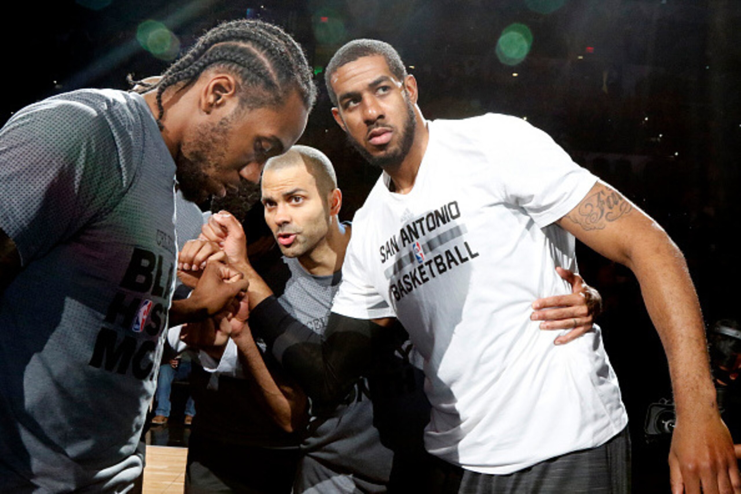 SAN ANTONIO,TX - FEBRUARY 3: Kawhi Leonard #2 of the San Antonio Spurs,Tony Parker #9 of the San Antonio Spurs and LaMarcus Aldridge #12 of the San Antonio Spurs huddle before their game against the New Orleans Pelicans at AT&T Center on February 3, 2016 