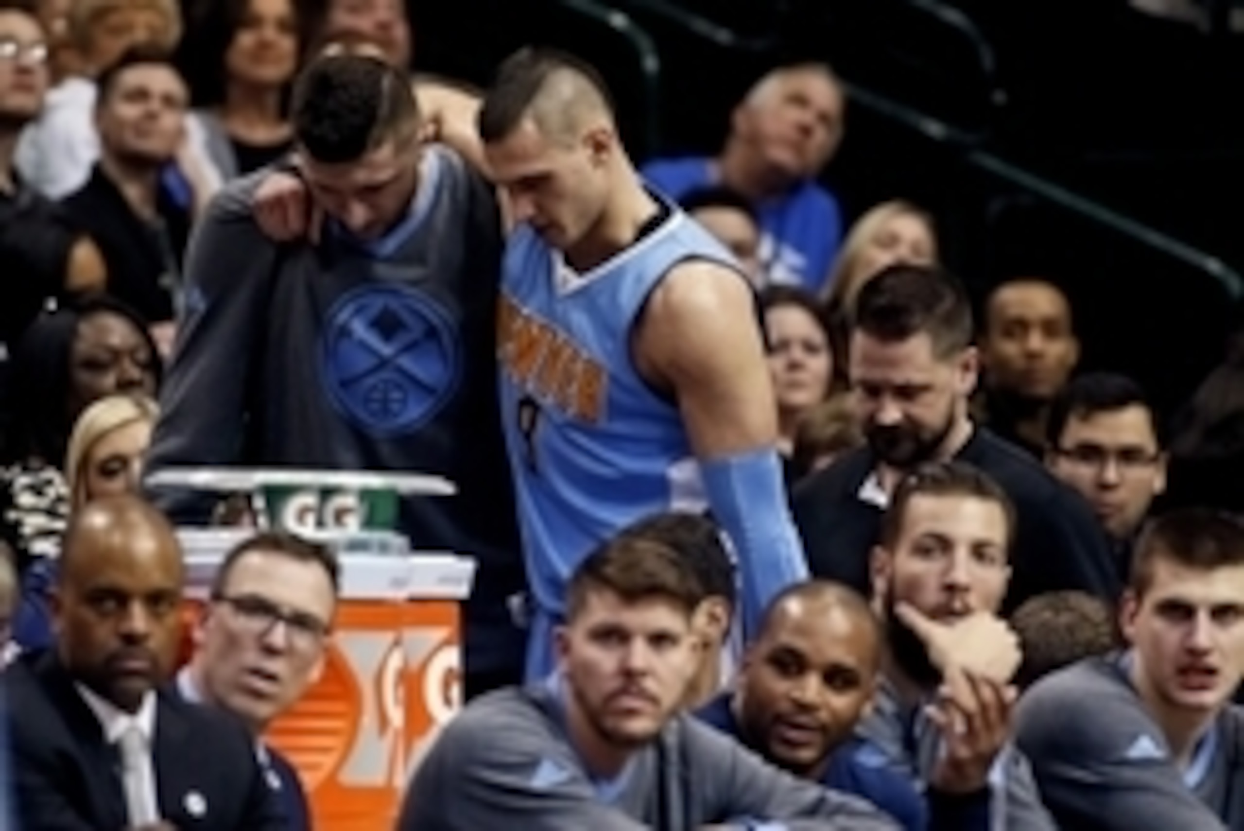 Feb 26, 2016; Dallas, TX, USA; Denver Nuggets forward Danilo Gallinari (8) is helped into the locker room after getting injured during the game against the Dallas Mavericks at American Airlines Center. Mandatory Credit: Kevin Jairaj-USA TODAY Sports