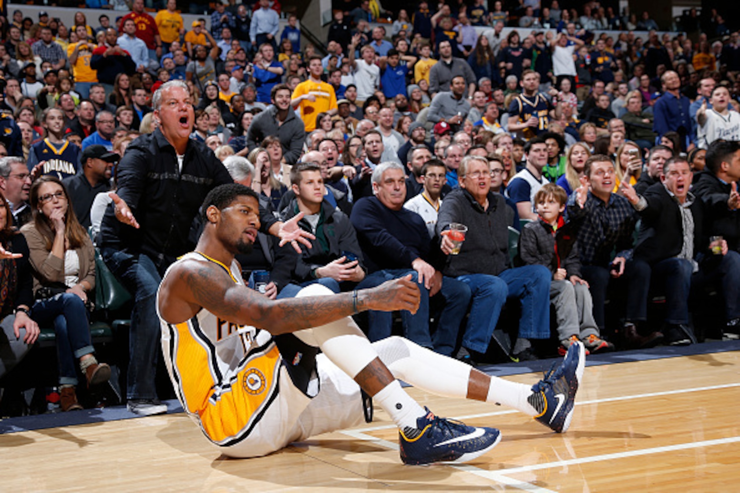 INDIANAPOLIS, IN - FEBRUARY 26: Paul George #13 of the Indiana Pacers reacts after being knocked down while shooting against the Charlotte Hornets in the second half of the game at Bankers Life Fieldhouse on February 26, 2016 in Indianapolis, Indiana. The