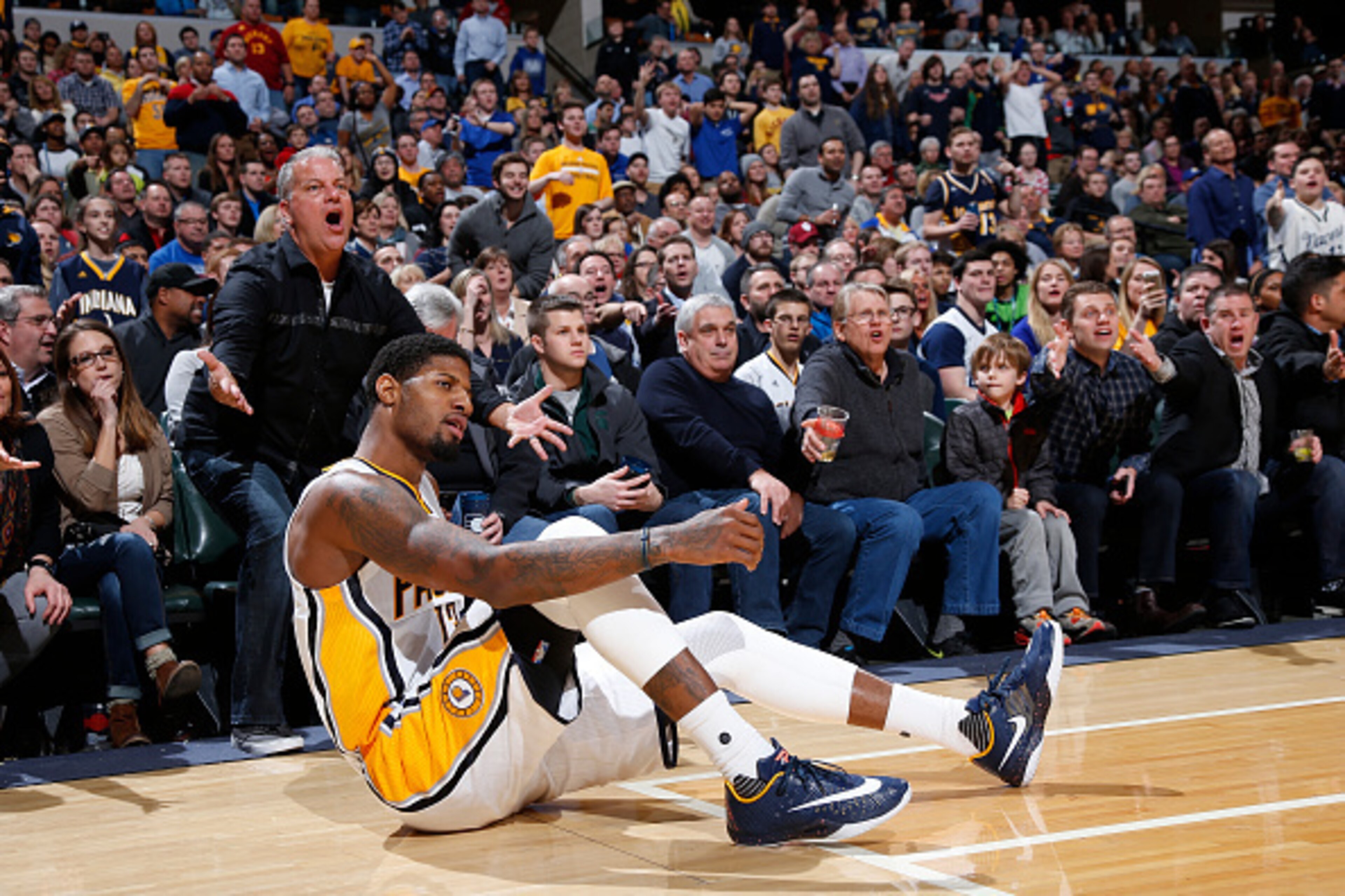 INDIANAPOLIS, IN - FEBRUARY 26: Paul George #13 of the Indiana Pacers reacts after being knocked down while shooting against the Charlotte Hornets in the second half of the game at Bankers Life Fieldhouse on February 26, 2016 in Indianapolis, Indiana. The