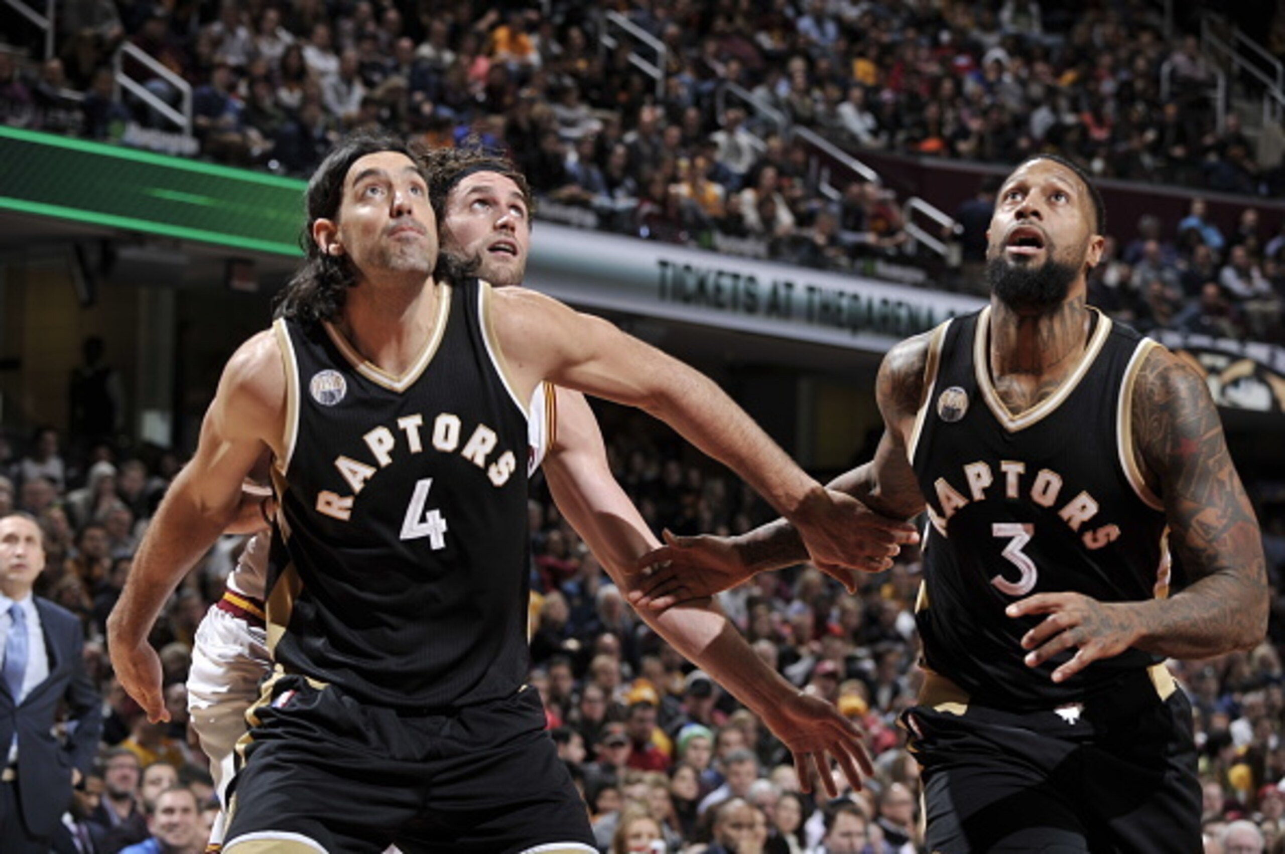 CLEVELAND, OH - JANUARY 4:  Luis Scola #4 and James Johnson #3 of the Toronto Raptors fights for position against Kevin Love #0 of the Cleveland Cavaliers on January 4, 2016 at Quicken Loans Arena in Cleveland, Ohio. NOTE TO USER: User expressly acknowled