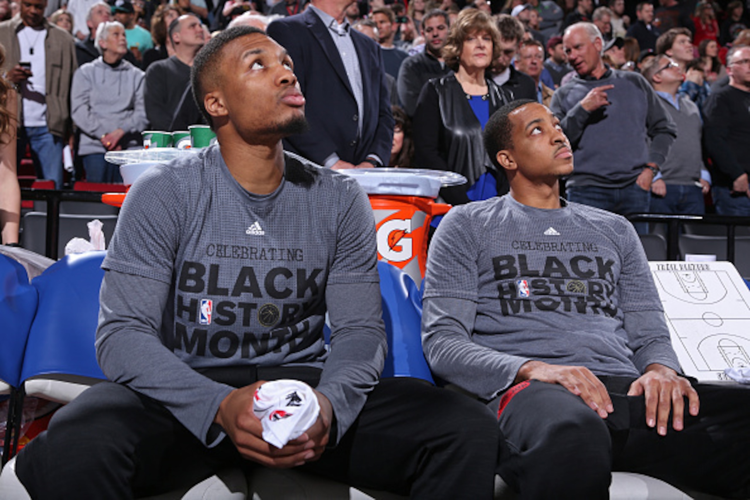 PORTLAND, OR - FEBRUARY 10:  Damian Lillard #0 and C.J. McCollum #3 of the Portland Trail Blazers sit on the bench before the game against the Houston Rockets on February 10, 2016 at the Moda Center Arena in Portland, Oregon. NOTE TO USER: User expressly 